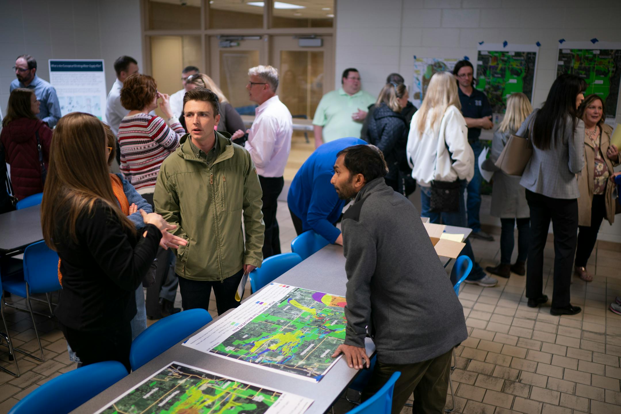 People reviewed maps and charts relating to the PFAS contamination before an October 2019 meeting in Washington County. Representatives from the Minnesota Department of Health, the Pollution Control Agency and the Department of Natural Resources presented background on PFAS and the 3M settlement.