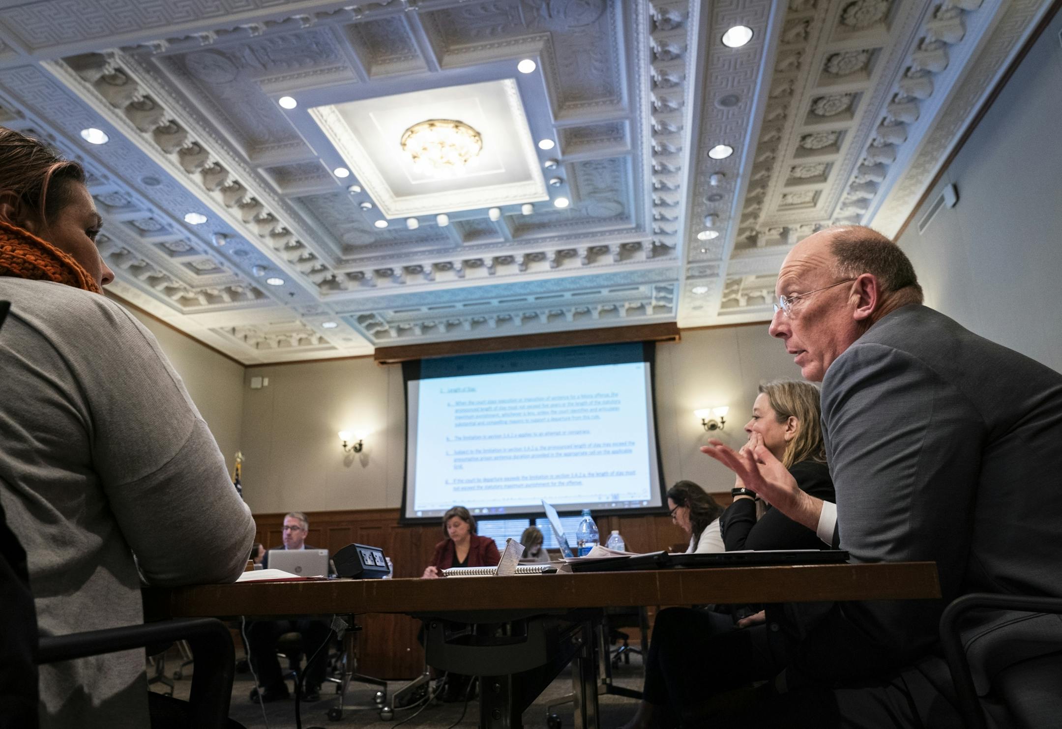 Minnesota Department of Corrections Commissioner Paul Schnell, right, spoke during a meeting of the Minnesota Sentencing Guidelines Commission.