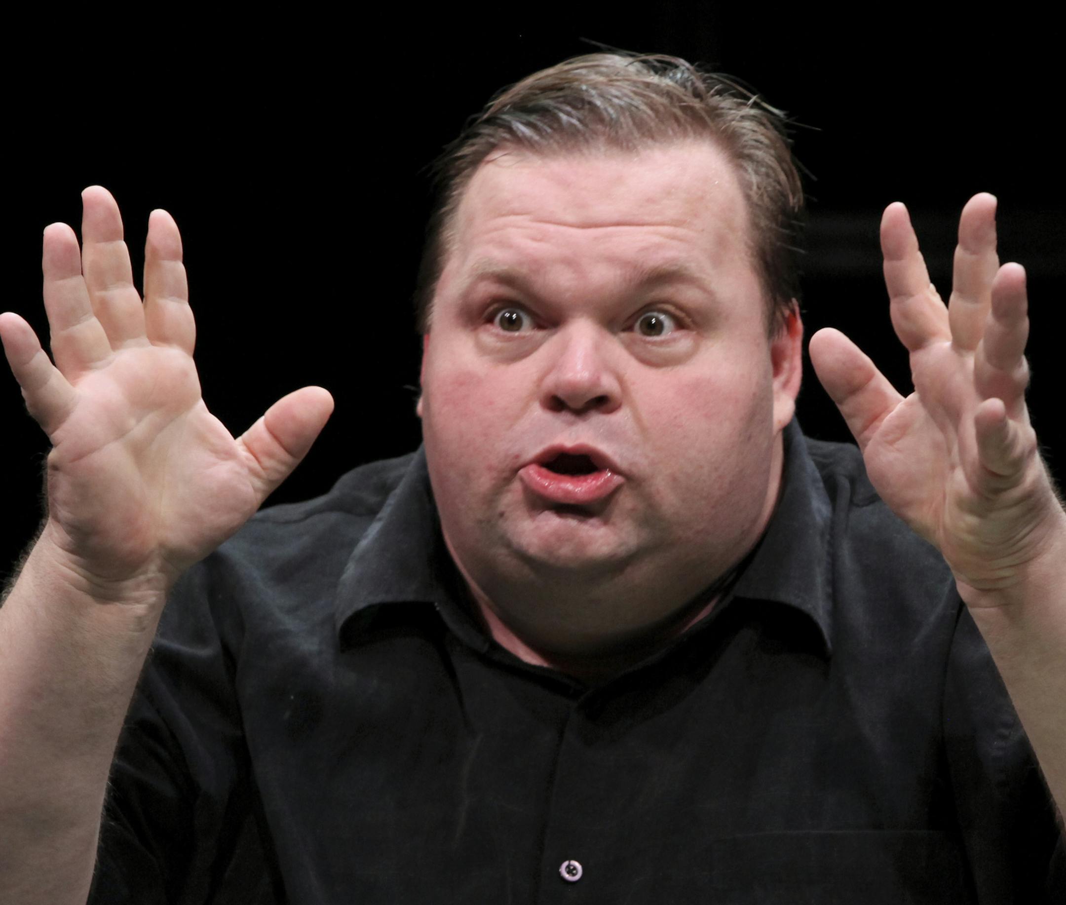 FILE -- Mike Daisey in "The Agony and the Ecstasy of Steve Jobs," at the Public Theater in New York, Oct. 9, 2011. The controversy that has erupted over Daisey's solo stage show raises a knotty issue that deserves examination in the light of the increasingly blurred lines, in various media, between entertainment and journalism. (Sara Krulwich/The New York Times)