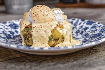 Crab Meat and Bacon Hash with Poached Eggs.