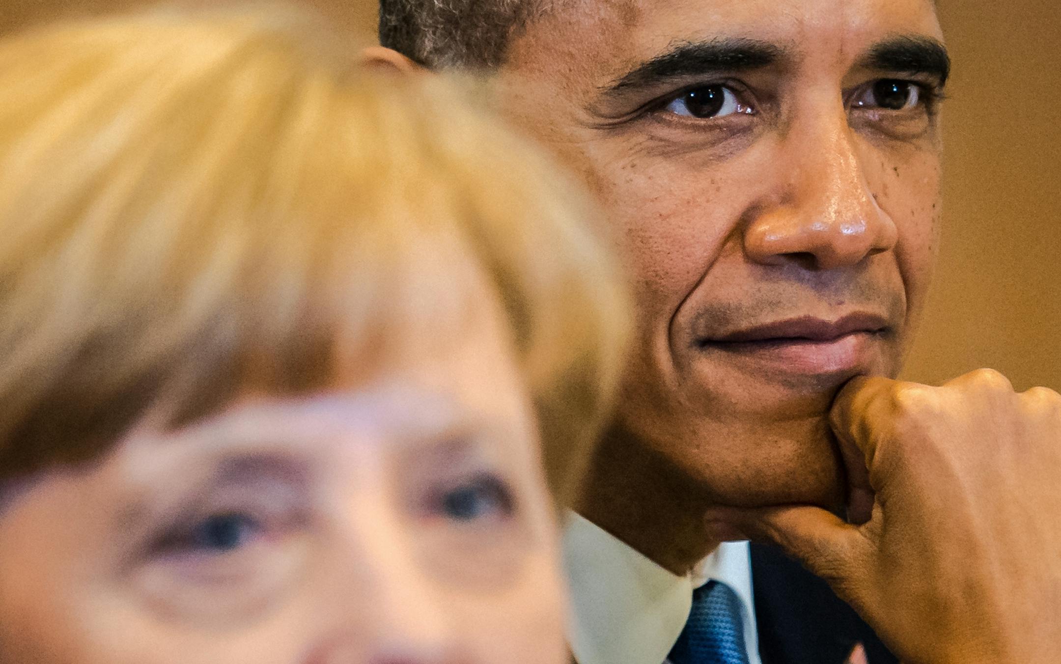 German Chancellor Angela Merkel, left, and U.S. President Barack Obama attend the first working session at a G7 summit in Brussels on Wednesday, June 4, 2014. The leaders of the Group of Seven are participating in a two day meeting in which they will discuss among other issues, the situation in Ukraine. (AP Photo/Geert Vanden Wijngaert)