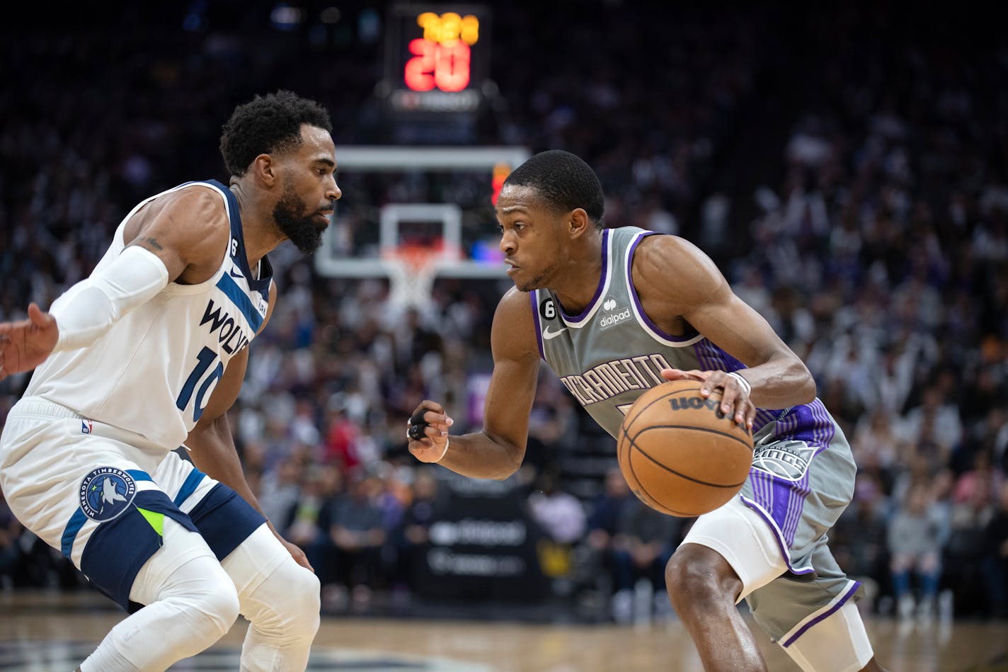 Minnesota Timberwolves guard Mike Conley (10) defends Sacramento Kings guard De'Aaron Fox (5) in the second half of an NBA basketball game in Sacramento, Calif., Saturday, March 4, 2023. The Timberwolves won 138-134. (AP Photo/José Luis Villegas)