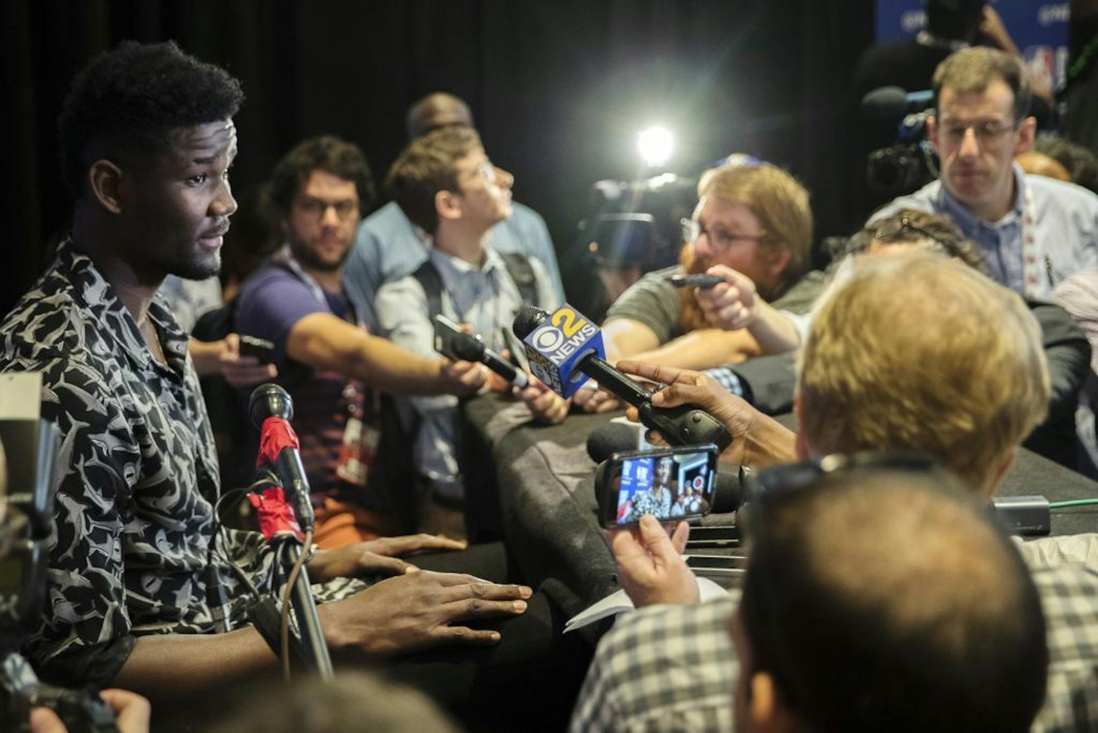 Arizona's DeAndre Ayton, left, speaks to reporters during a media availability with the top basketball prospects in the NBA Draft, Wednesday, June 20, 2018, in New York.