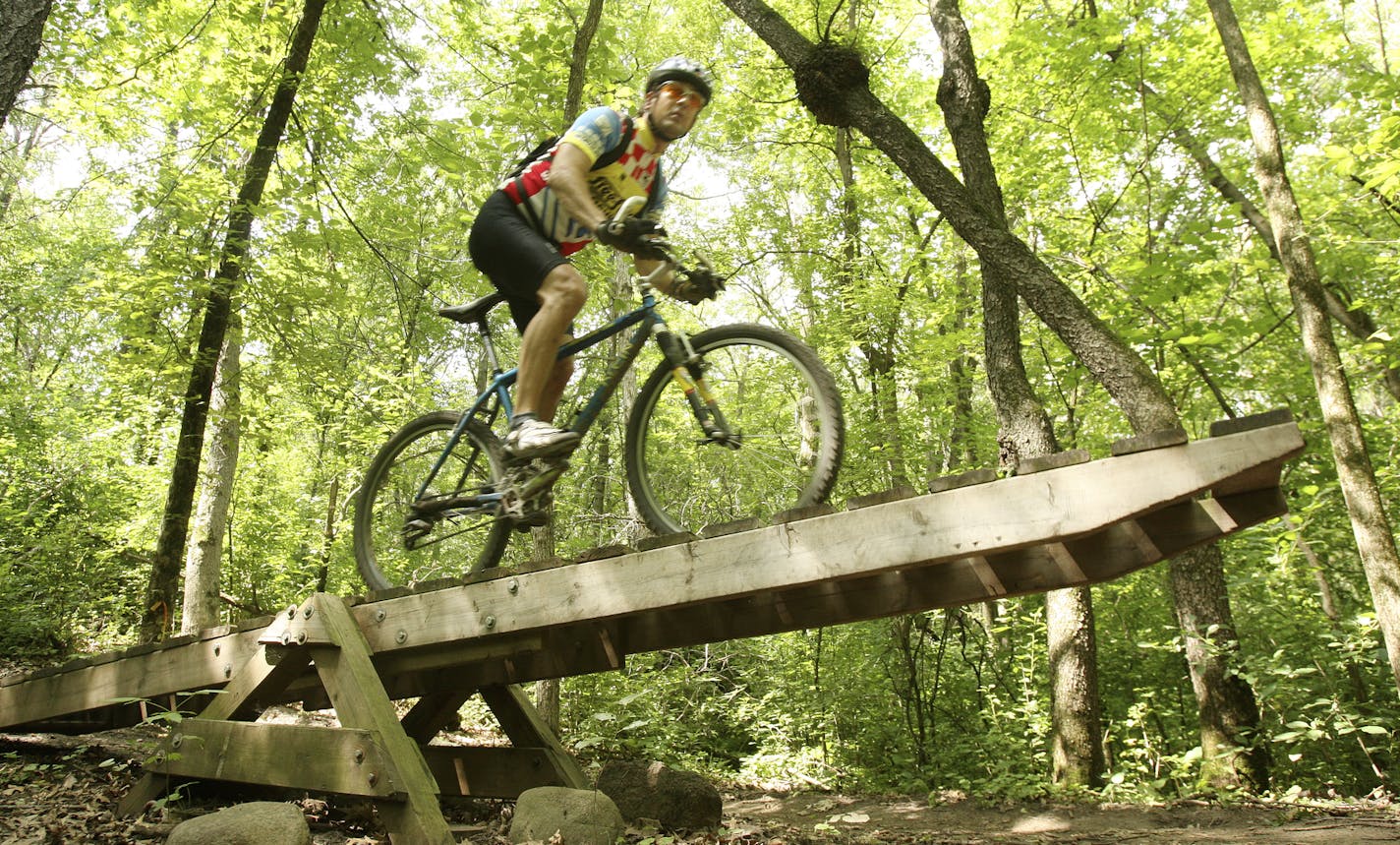 Courtesy of Dakota County Lebanon Hills has become a mecca for mountain bikers as a result of a collaboration between a mountain bike organization and the county. The county had the land and the bike group built trails on it and maintains them. Now since the county opened a restroom and parking lot at the trail head women and families have joined the typically male group of bikers.