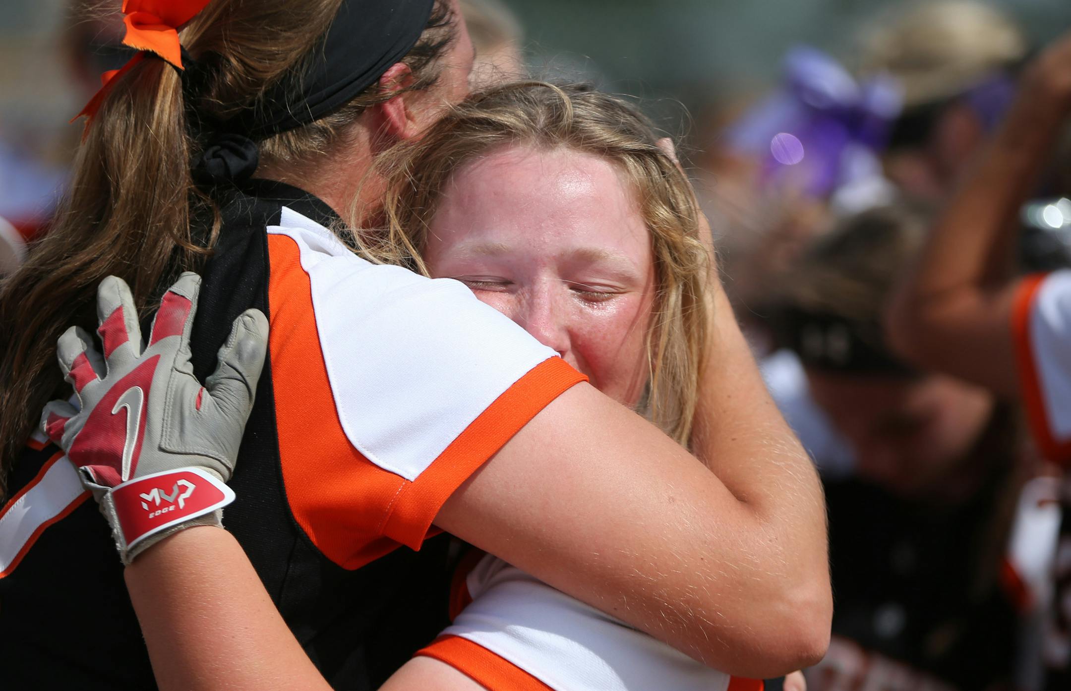Farmington infielder Olivia Hazelbaker celebrated with Emma Frost after their victory. ] MARK VANCLEAVE &#xef; mark.vancleave@startribune.com * The Farmington Tigers defeated the Anoka Tornadoes 1-0 with a home run in the tenth inning, winning the Class 4A state championship on Friday, July 9, 2017 in North Mankato.