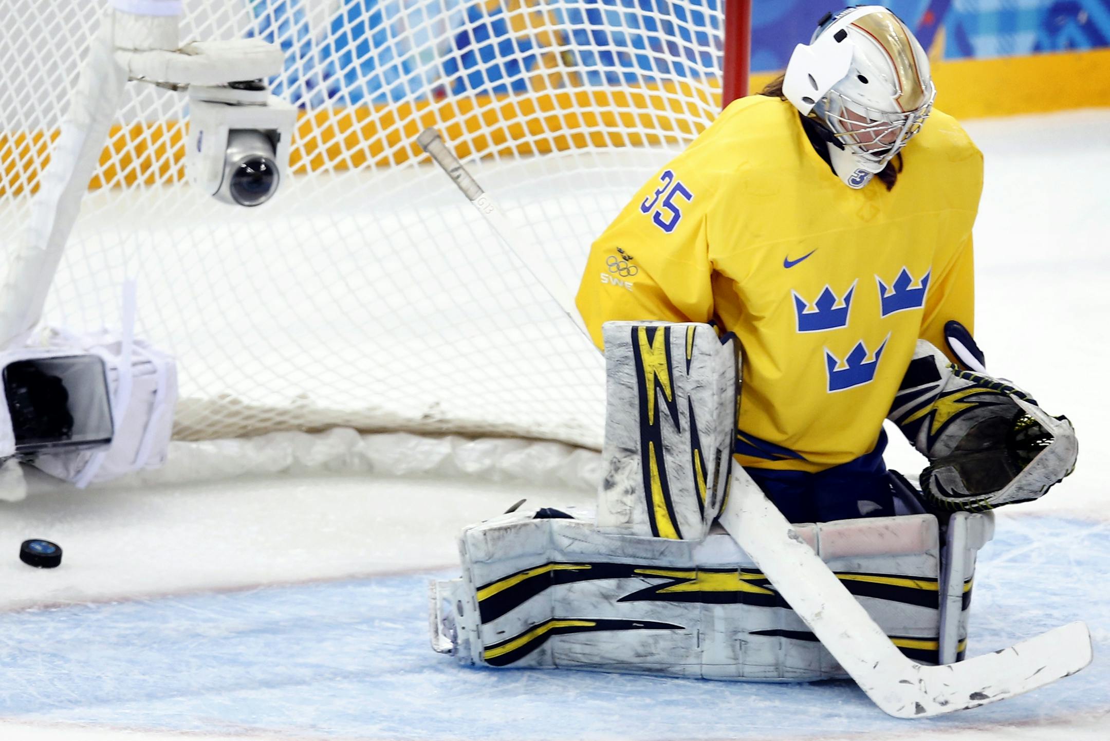 Megan Bozek (9) shot the puck past Sweden goalie Valentina Wallner (35) for a goal in the second period. USA beat Sweden by a final score of 6-1.