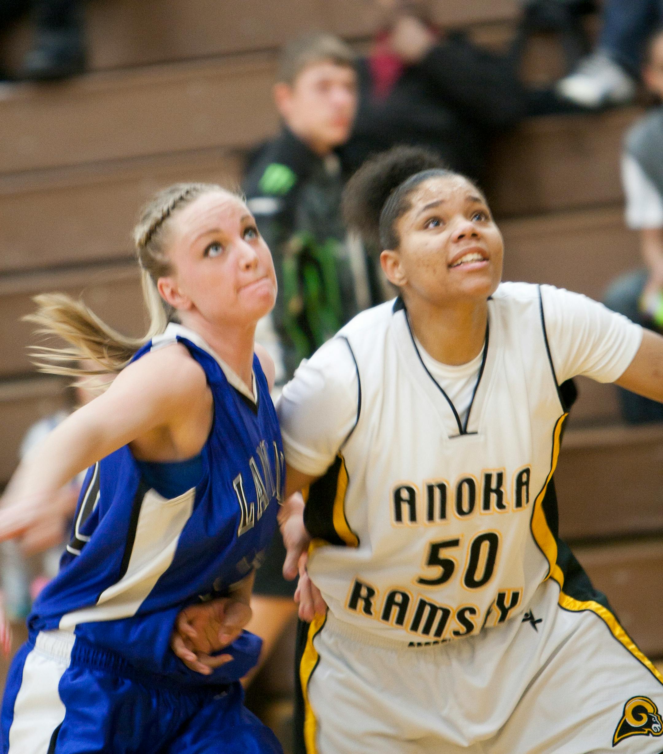 Anoka-Ramsey freshman Tracy McGregor (from Hopkins) battled for rebound position against Alyssa Smith of Minnesota West.