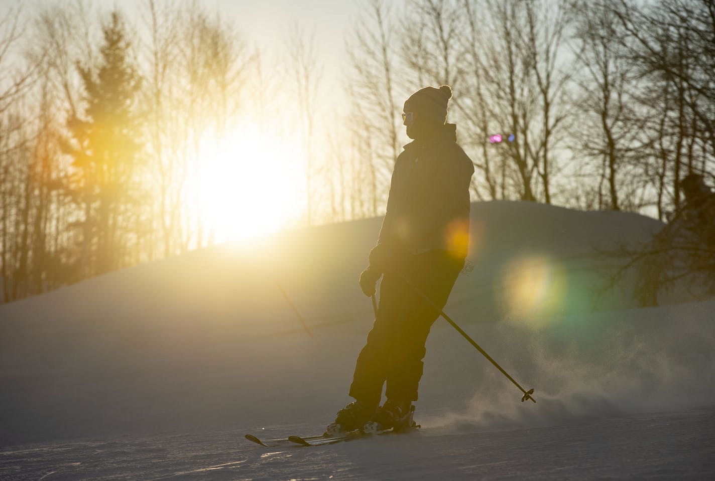 A skier descended a Spirit Mountain run at sunset on Dec. 17, 2019. Spirit Mountain's executive director is resigning just as the city launches a task force to examine the public ski hill's future.