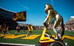Goldy Gopher and the University of Minnesota spirit quad stormed the field after a rushing touchdown last season vs. Rutgers.