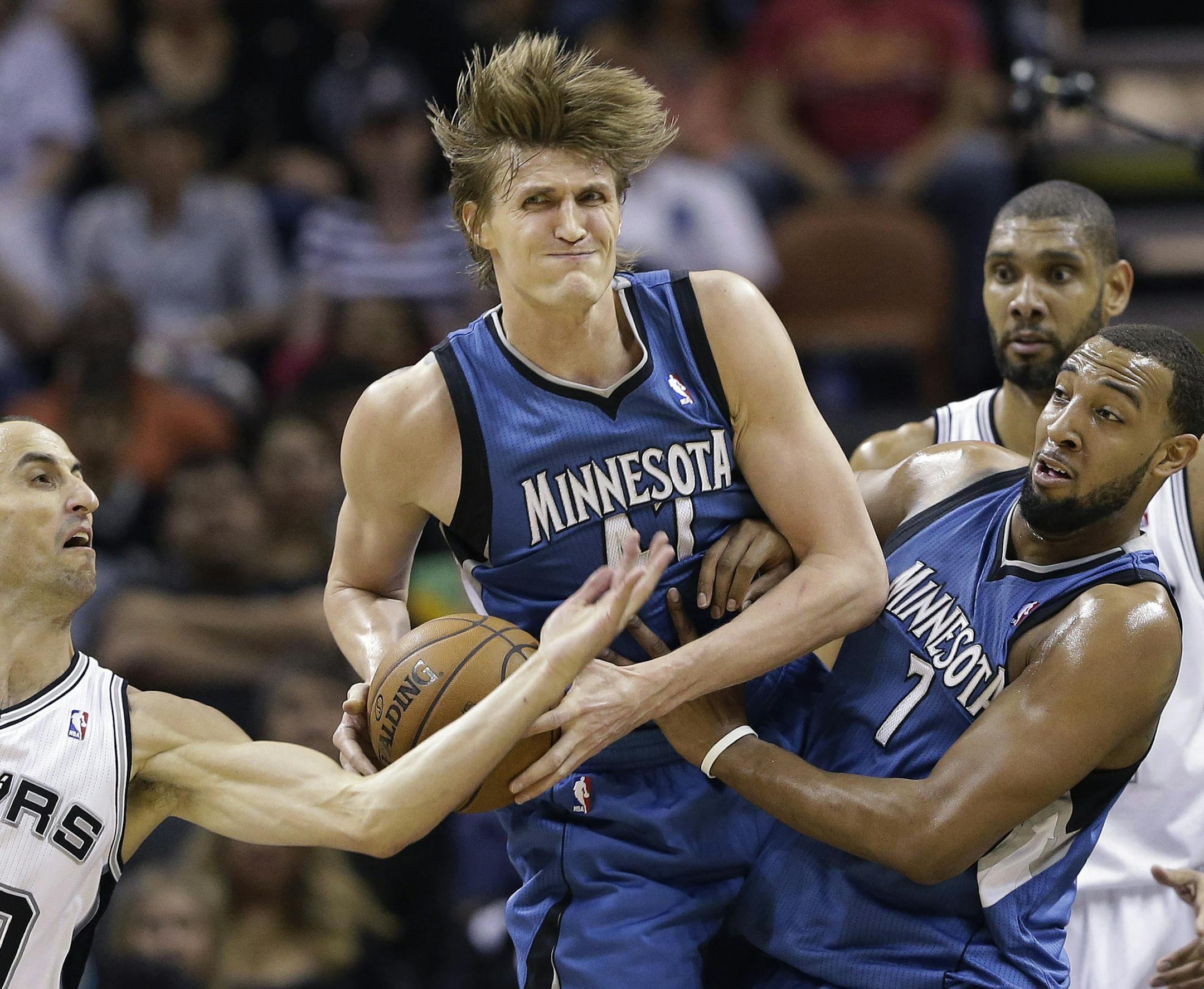 Andrei Kirilenko, center.