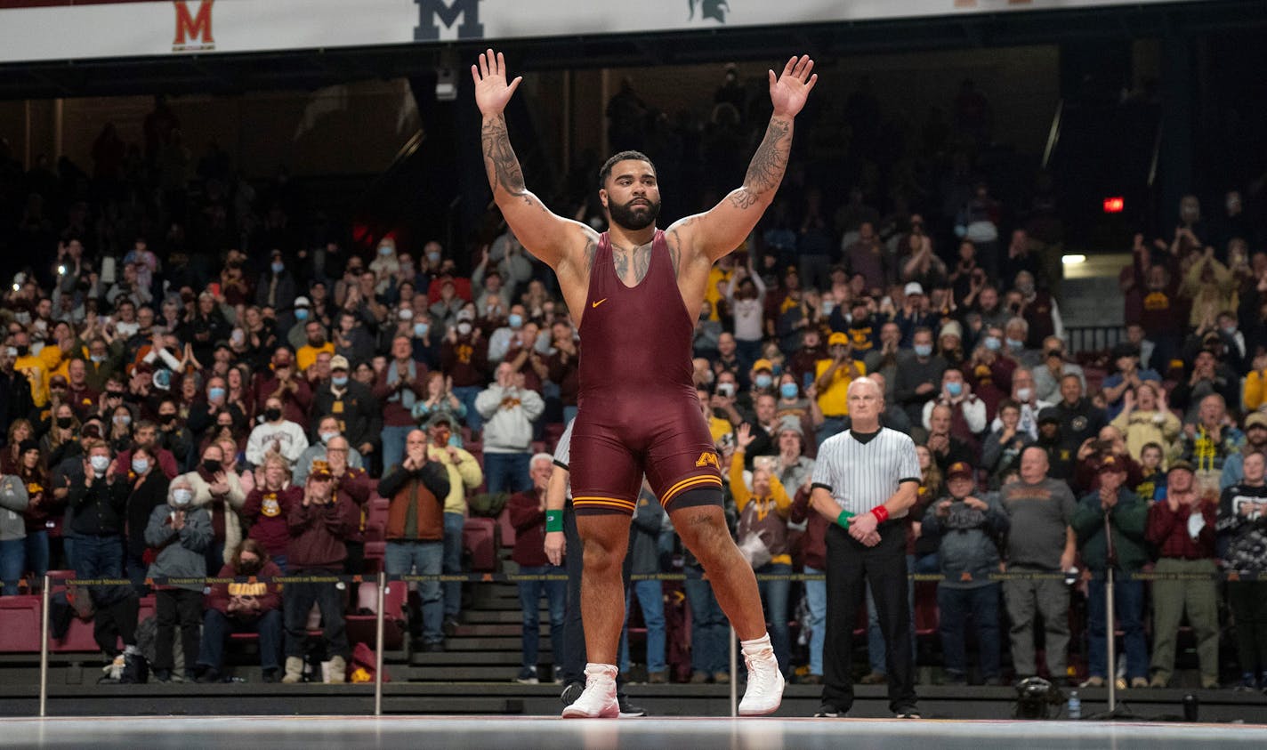 Gable Steveson waves to the crowd after defeating Tate Orndorff from Ohio State with a technical fall in his final home meet Friday, Feb. 11, 2022 at Maturi Pavilion in Minneapolis, Minn. Steveson is the nation's No. 1-ranked heavyweight and defending NCAA and Olympic champion. He rose to national fame when he won the gold medal in men's freestyle 125kg wrestling for Team USA in the 2020 Summer Olympics in Tokyo. ]