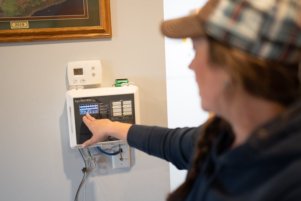 Erica Sawatzke showed her farm’s alarm system, which is connected by a landline.