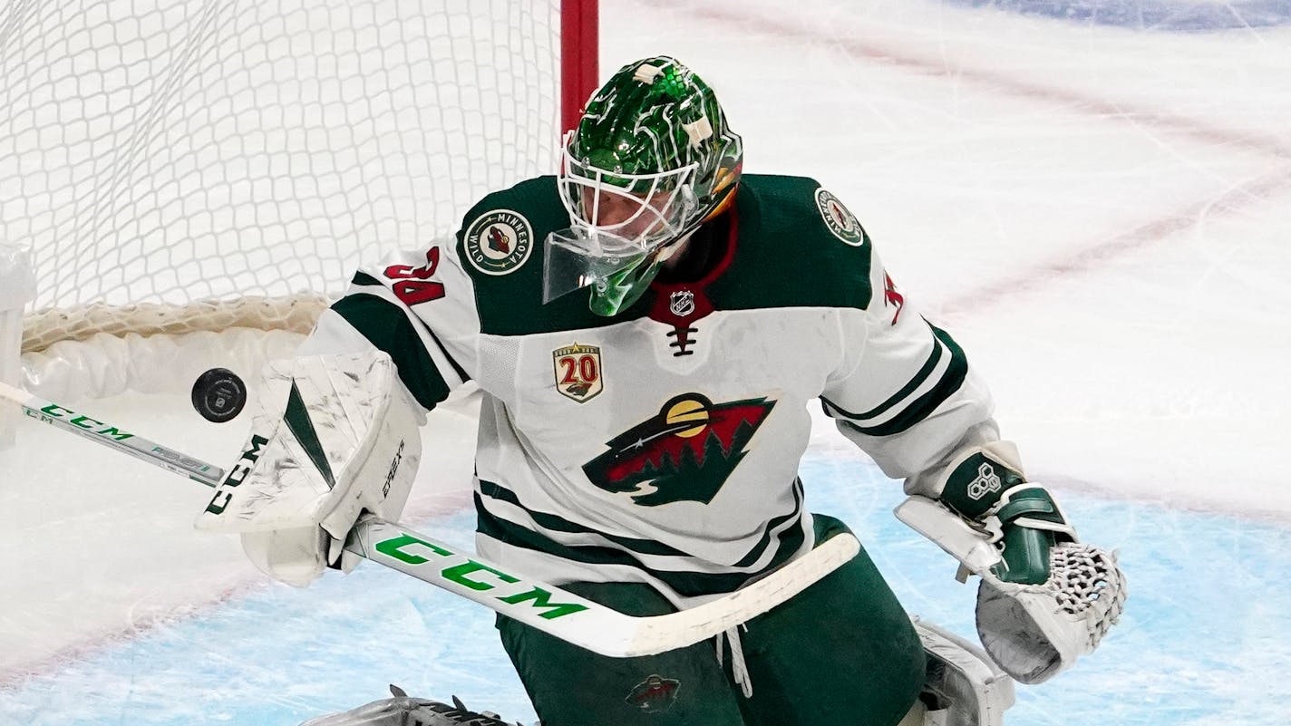 Minnesota Wild goaltender Kaapo Kahkonen deflects a shot during the first period of an NHL hockey game against the Los Angeles Kings Tuesday, Feb. 16, 2021, in Los Angeles. (AP Photo/Mark J. Terrill)