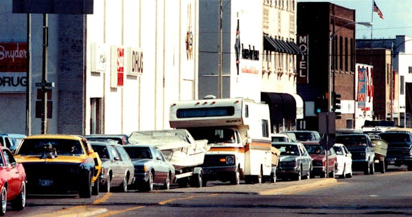 In this 1989 file photo, cars filled with weekend travelers line up on 6th Street in Brainerd.