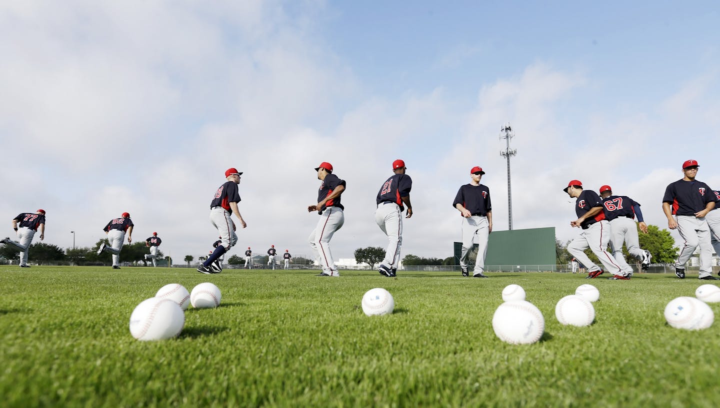 Minnesota Twins players stretched out on their first day of pitchers and catchers working out Wednesday Feb.13, 2013 at Lee County Sports Complex in Fort Myers, FL.