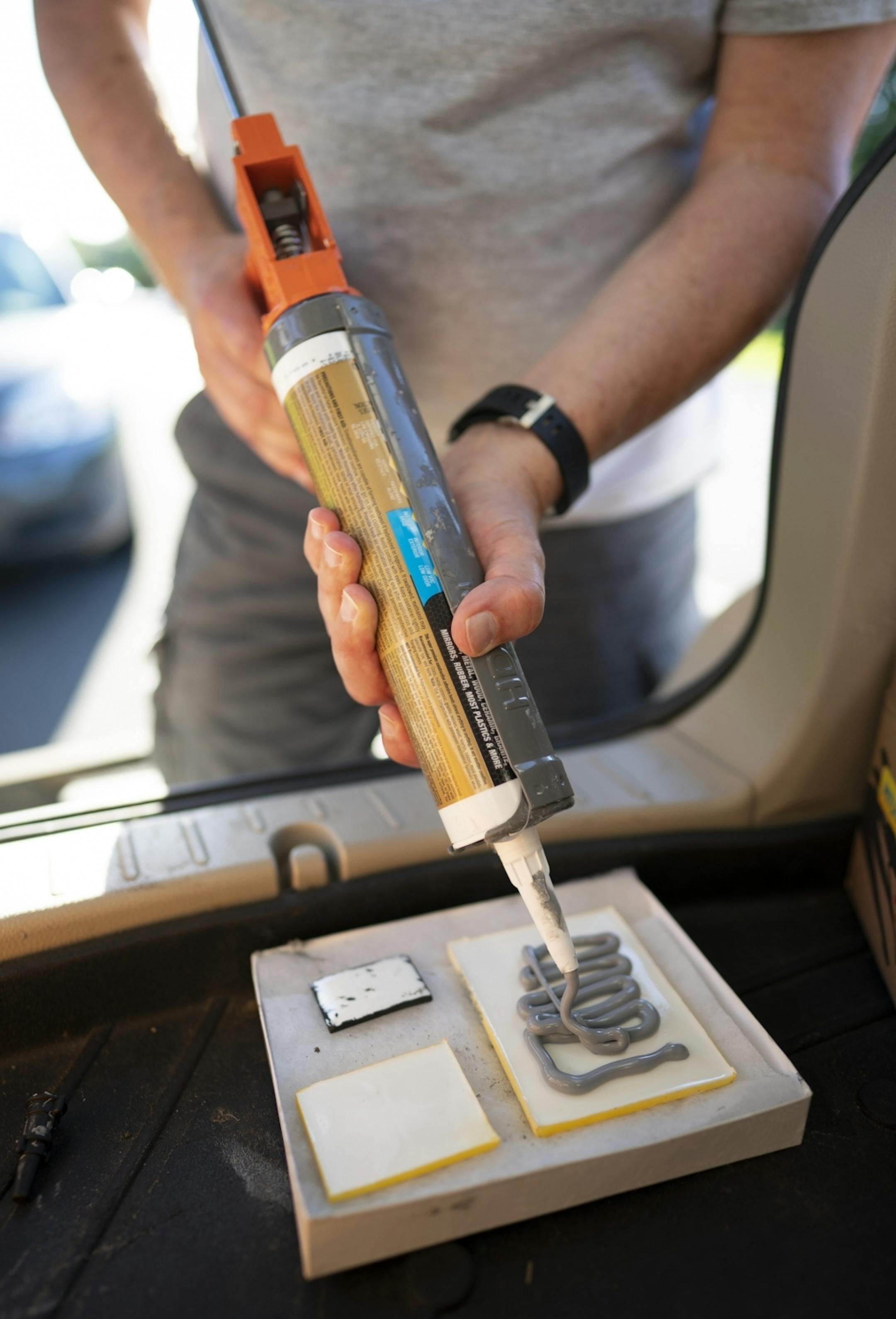 Mous510 applied adhesive to the back of one of his mouse doors before an installation.