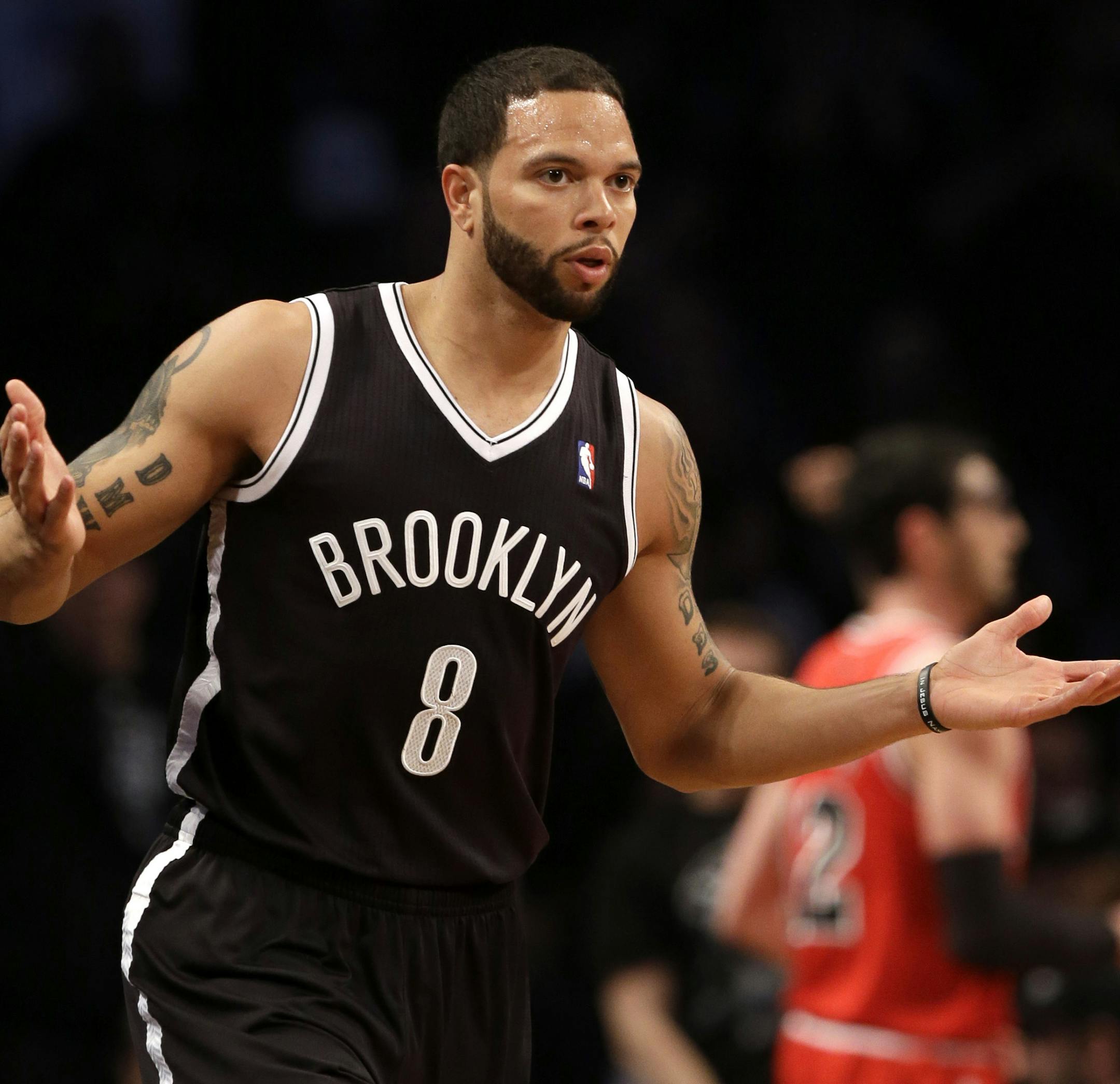 Brooklyn Nets' Deron Williams reacts after scoring against the Chicago Bulls during the first quarter of Game 1 of a first-round series of the NBA basketball playoffs, Saturday, April 20, 2013, in New York. (AP Photo/Seth Wenig)