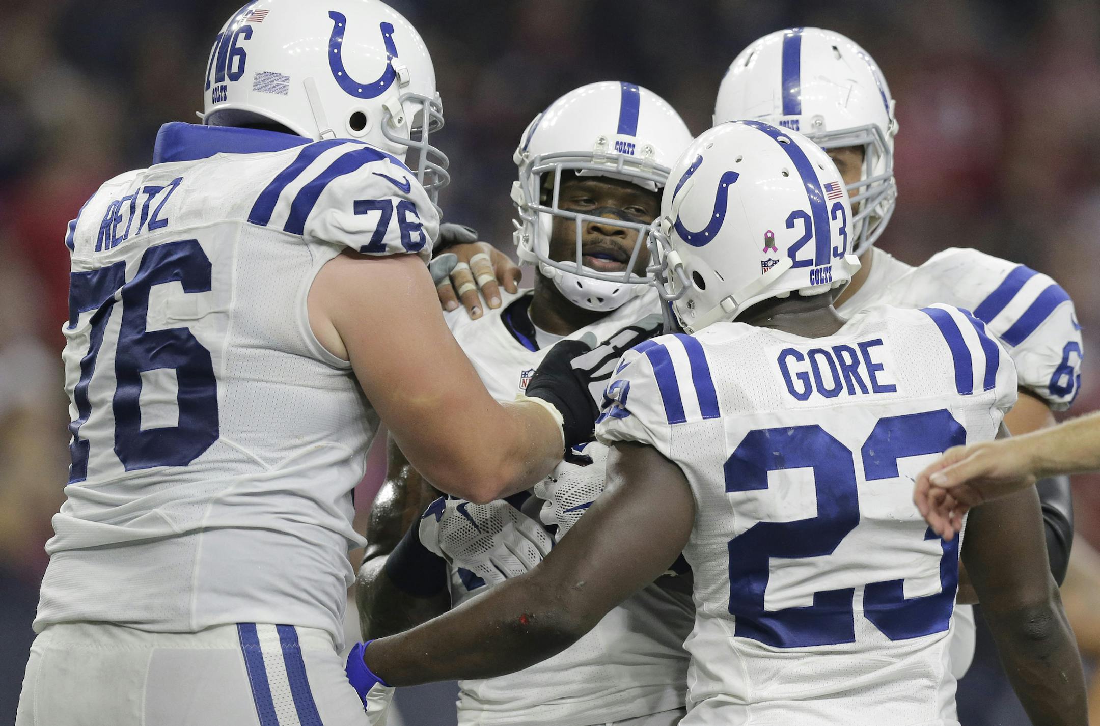 Indianapolis Colts' Andre Johnson, center, celebrates with teammates after a touchdown catch against the Houston Texans during the second half of an NFL football game Thursday, Oct. 8, 2015, in Houston. (AP Photo/Patric Schneider)