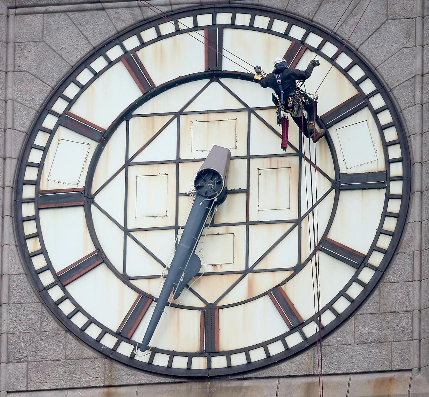 The historic clock atop City Hall was stopped shortly after 6:30 a.m. to allow crew members to get inside the tower and gussy up the late-19th century landmark downtown, Monday, January 19, 2015 in Minneapolis, MN.