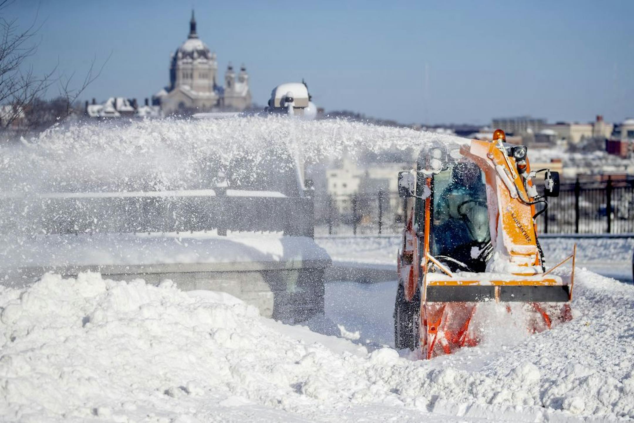 A city of St. Paul snow crew removed snow from the Smith Avenue Bridge, Friday, February 8, 2019 in St. Paul, MN.