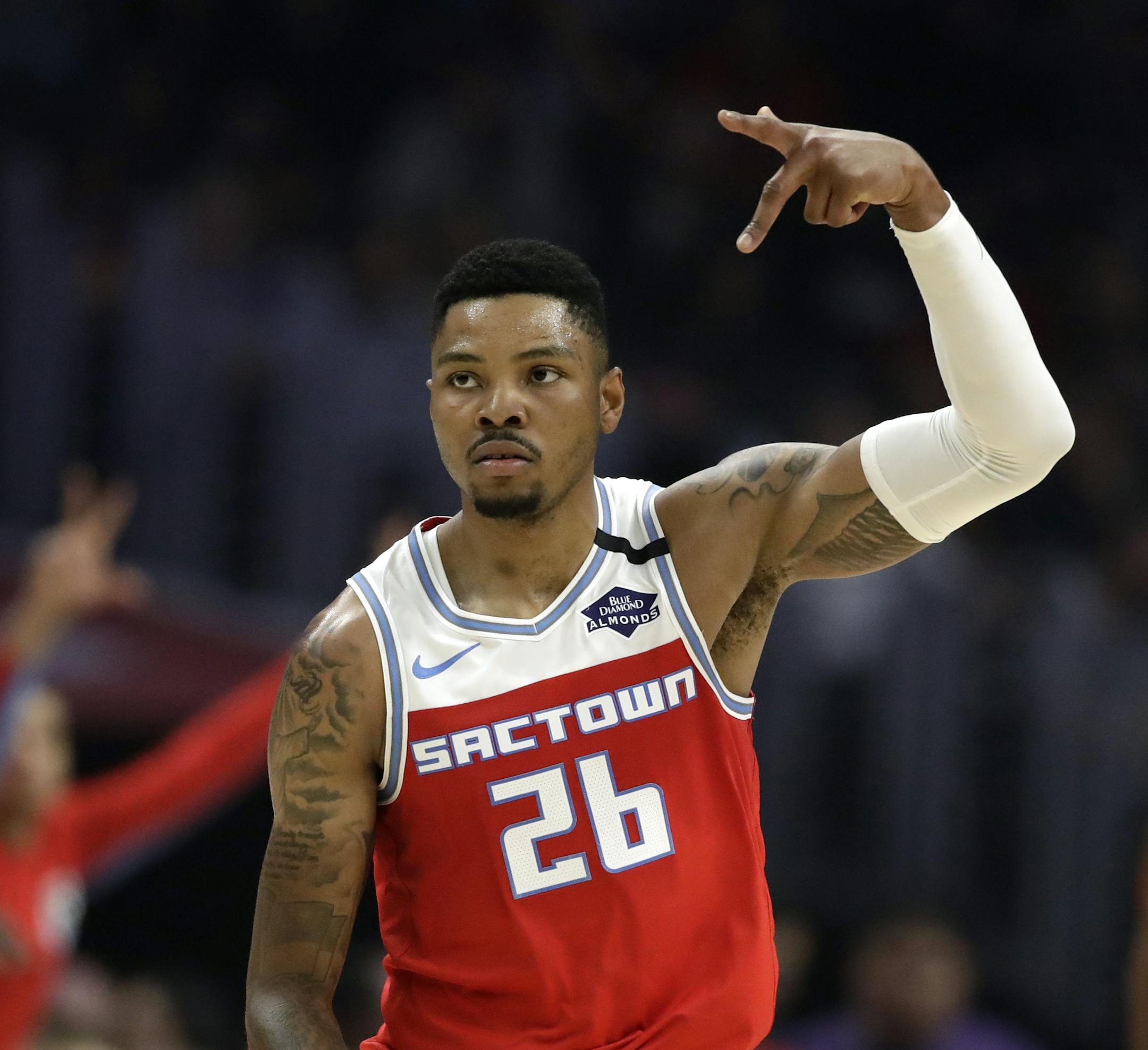 Sacramento Kings' Kent Bazemore (26) reacts after scoring against the Los Angeles Clippers during the first half of an NBA basketball game Saturday, Feb. 22, 2020, in Los Angeles. (AP Photo/Marcio Jose Sanchez)