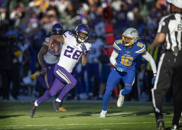 Los Angeles Chargers wide receiver Andre Patton (16) chased Minnesota Vikings cornerback Trae Waynes (26) after he intercepted a pass in the fourth qu