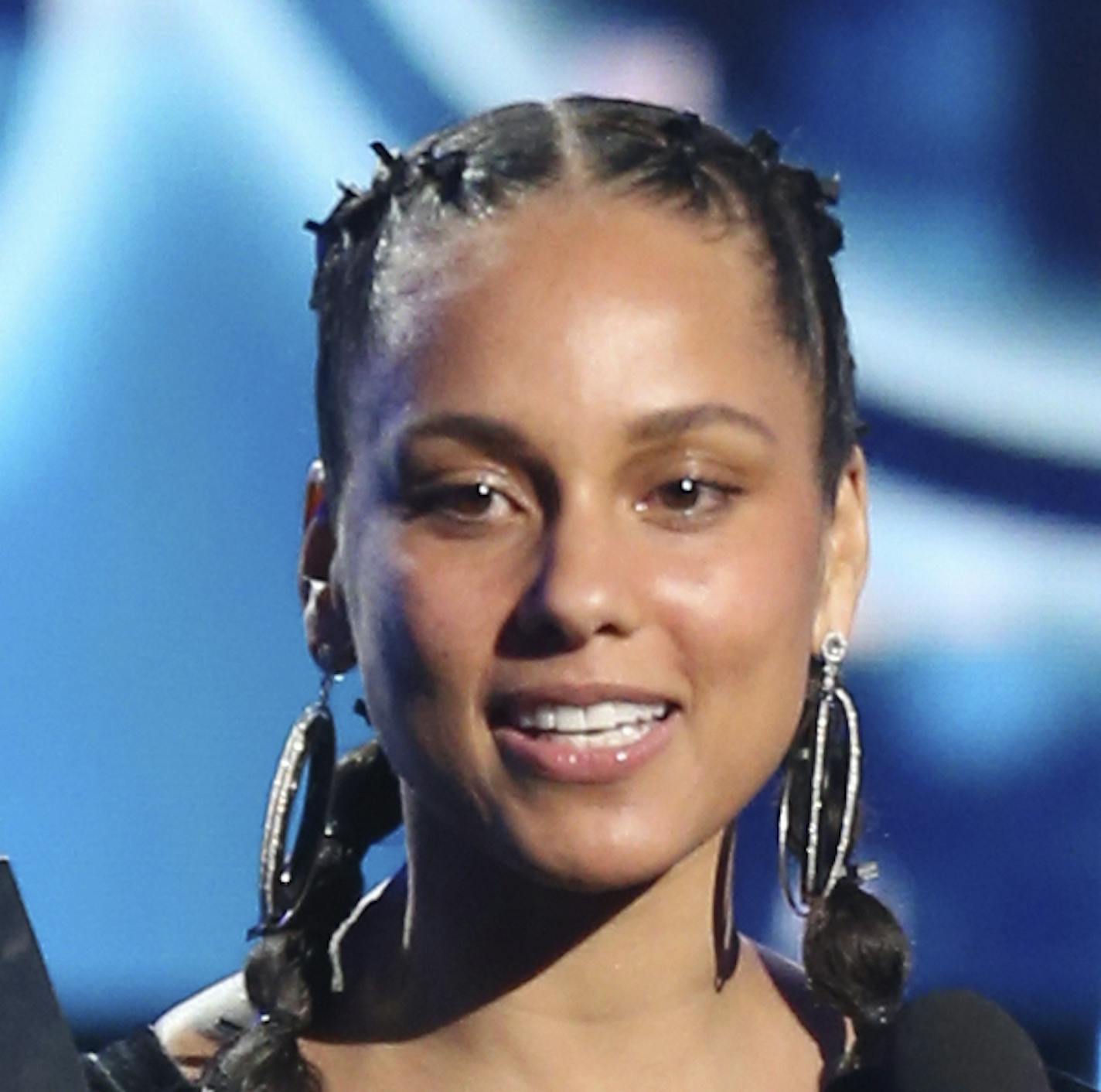 FILE - In this Jan. 28, 2018 file photo, Alicia Keys presents the award for record of the year at the 60th annual Grammy Awards at Madison Square Garden in New York. The Recording Academy announced Tuesday, Jan. 15, 2019, that Keys will host the Feb. 10 Grammys for the first time. The show will air live on CBS in Los Angles. (Photo by Matt Sayles/Invision/AP, File)