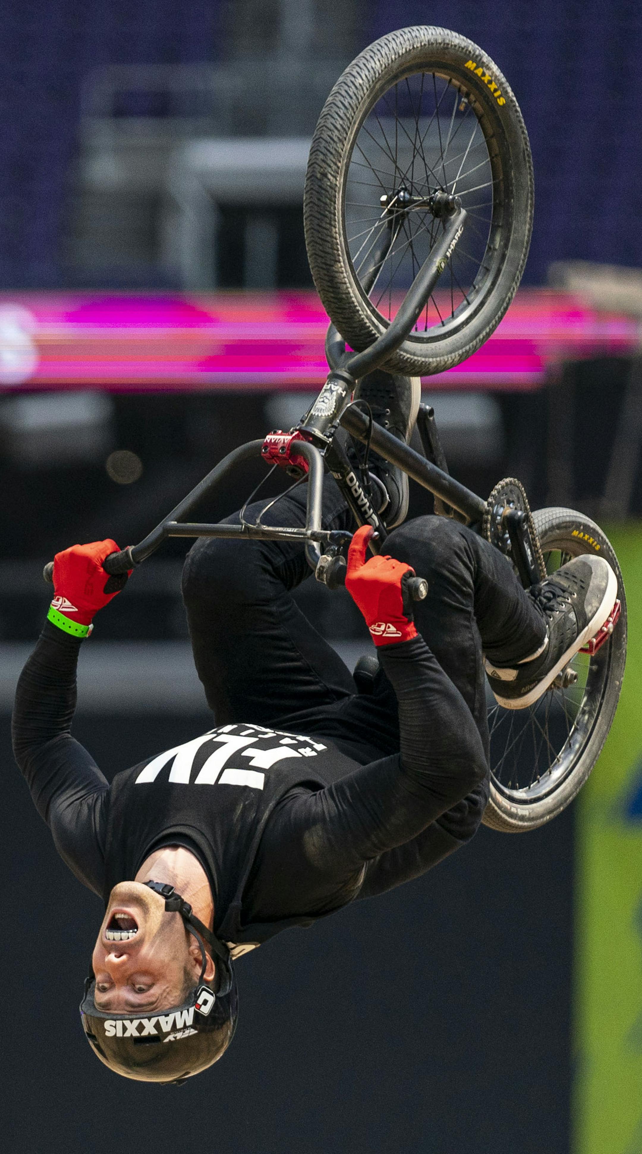 A BMX biker does a back flip during the BMX dirt elimination round on Thursday.] ALEX KORMANN • alex.kormann@startribune.com The first day of X Games competition kicked off Thursday August 1, 2019 at U.S. Bank stadium with many of the big air events.