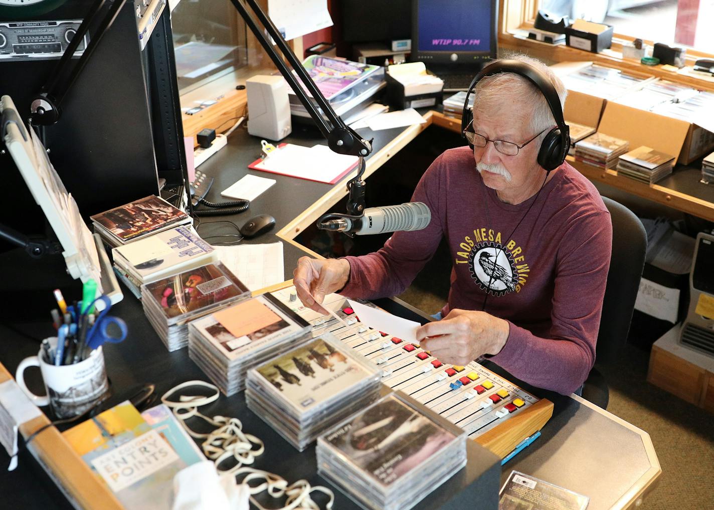 Volunteer Carl Solander's guest hosted the Sidetracks radio program at WTIP. ] ANTHONY SOUFFLE &#xef; anthony.souffle@startribune.com Staff and volunteers at WTIP North Shore Community Radio worked in the station's studio Thursday, July 12, 2018 in Grand Marais, Minn. The little community radio station on the tip of Minnesota has turned into a small powerhouse in its 20 years. It just won an Edward R. Murrow award and has a significant following far beyond Northern Minnesota. People who vacation