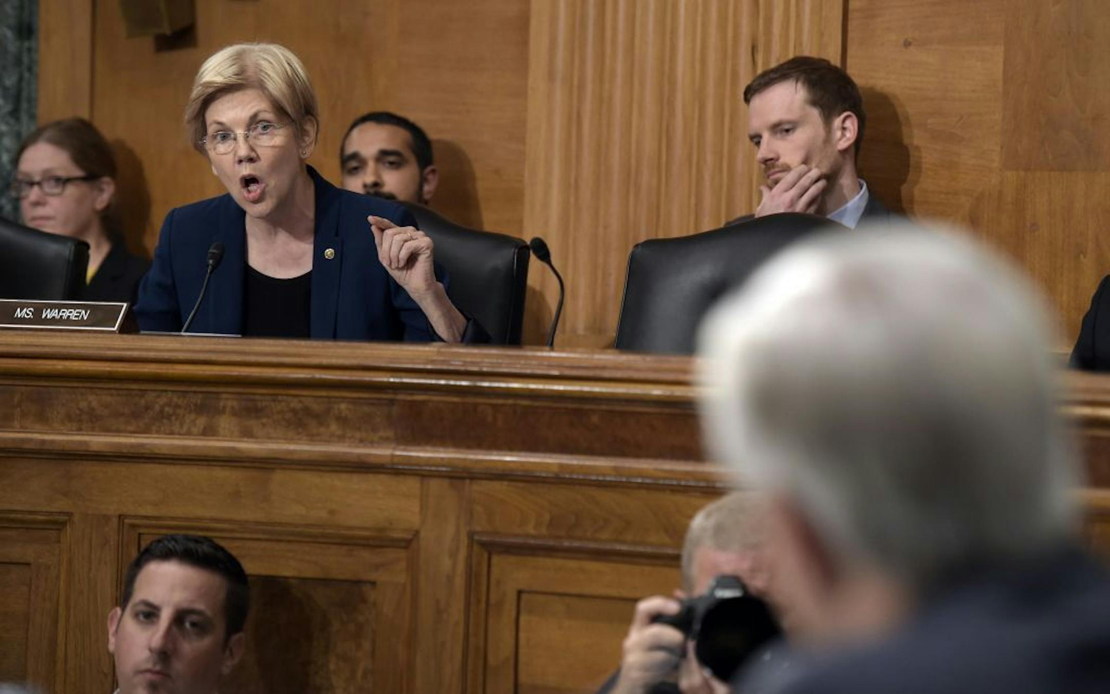 Senate Banking Committee member Sen. Elizabeth Warren, D-Mass., left, questions Wells Fargo Chief Executive Officer John Stumpf, on Capitol Hill in Washington, Tuesday, Sept. 20, 2016, during the committee's hearing. Stumpf was called before the committee for betraying customers' trust in a scandal over allegations that employees opened millions of unauthorized accounts to meet aggressive sales targets.