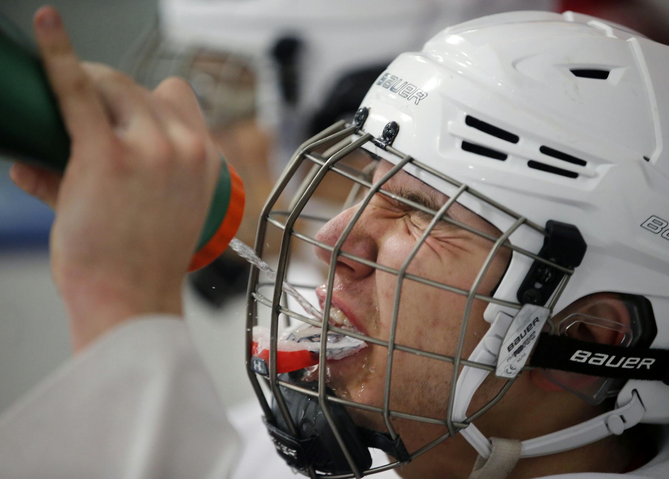 At the Charles M. Schulz - Highland Arena Complex, the Scots took on their rival Como H.S. in a game they lost in the last minute. Sophomore defenseman Lee Froelich kept hydrated in a very tense game that went back and forth. The Scots lost on a score off a face-off in the last minute.] rtsong-taatarii@startribune.com/ Richard Tsong-Taatarii