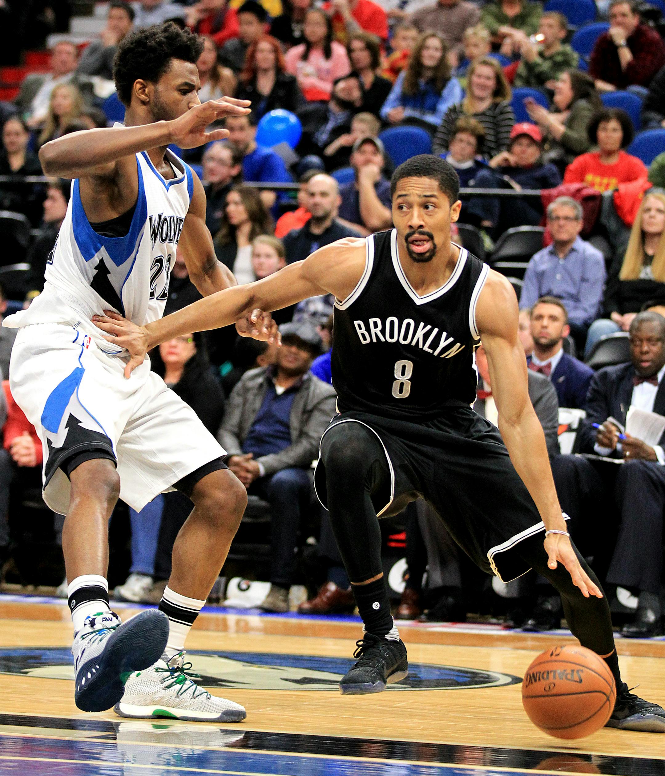 Brooklyn Nets guard Spencer Dinwiddie (8) drives on Minnesota Timberwolves guard Andrew Wiggins (22) during the second quarter of an NBA basketball in Minneapolis, Saturday, Jan. 28, 2017.(AP Photo/Andy Clayton-King)