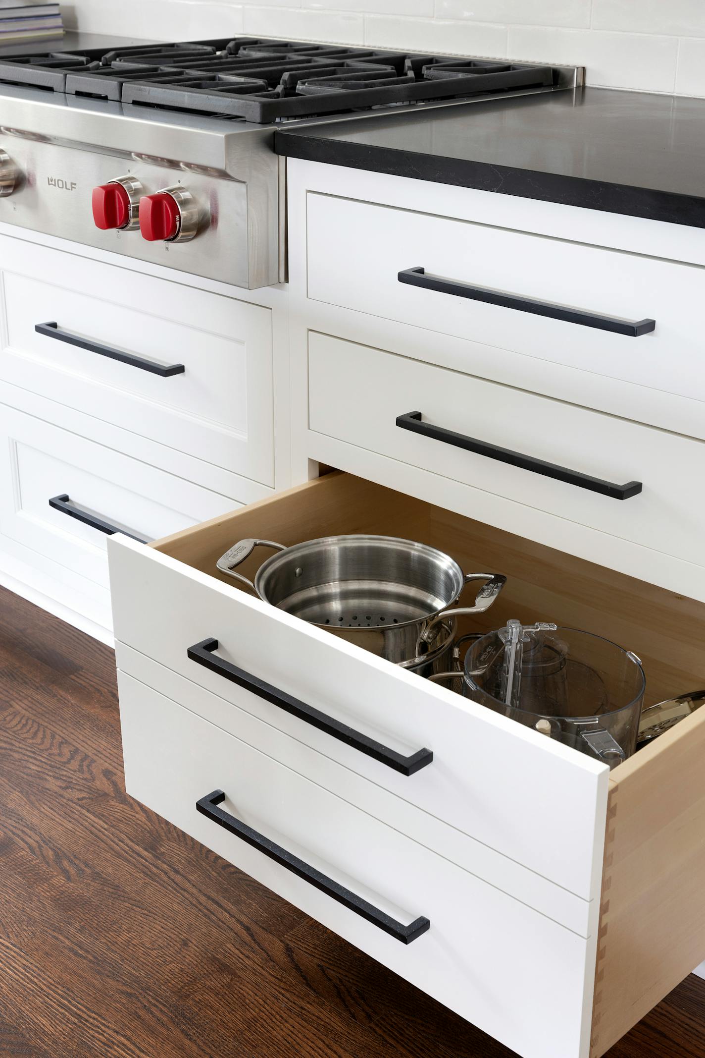 A deep drawer next to the stove stores prep and cookware such as the pasta pot.