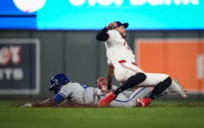 Kansas City Royals left fielder Dairon Blanco (44) is caught stealing by Twins shortstop Carlos Correa (4) in the top of the ninth inning on Tuesday.