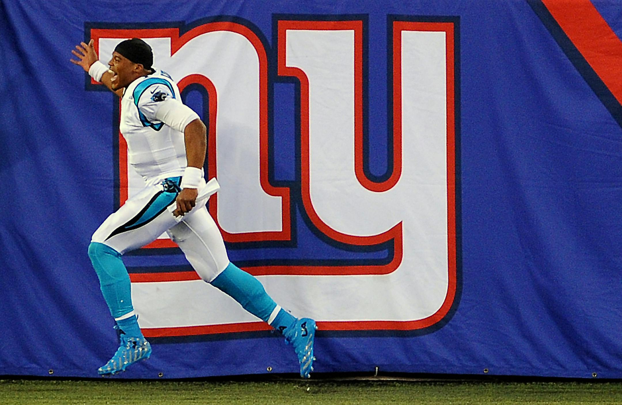 Carolina Panthers quarterback Cam Newton celebrates his team's 38-35 victory against the New York Giants at MetLife Stadium in East Rutherford, N.J., on Sunday, Dec. 20, 2015. (Jeff Siner/Charlotte Observer/TNS)