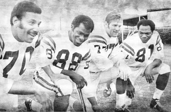 The 1969 Vikings defensive line -- Jim Marshall, Alan Page, Gary Larsen and Carl Eller -- was known as the Purple People Eaters. This photo was taken 