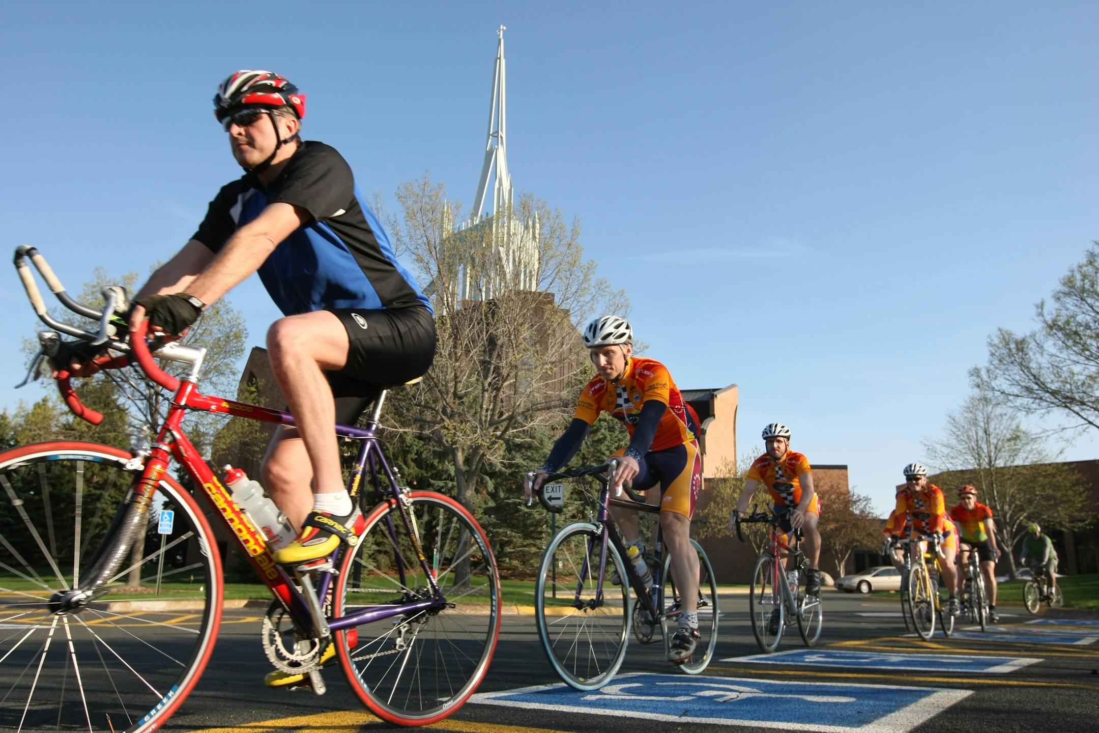 Woodale will encourage its members to bike to church, at thier new, second location in an Edina neighborhood this summer. In this photo Members of a Christian riding group called Twin Cities Spoke International cycling club took-off after they met in the Woodale Church in Eden Prairie for a club ride.