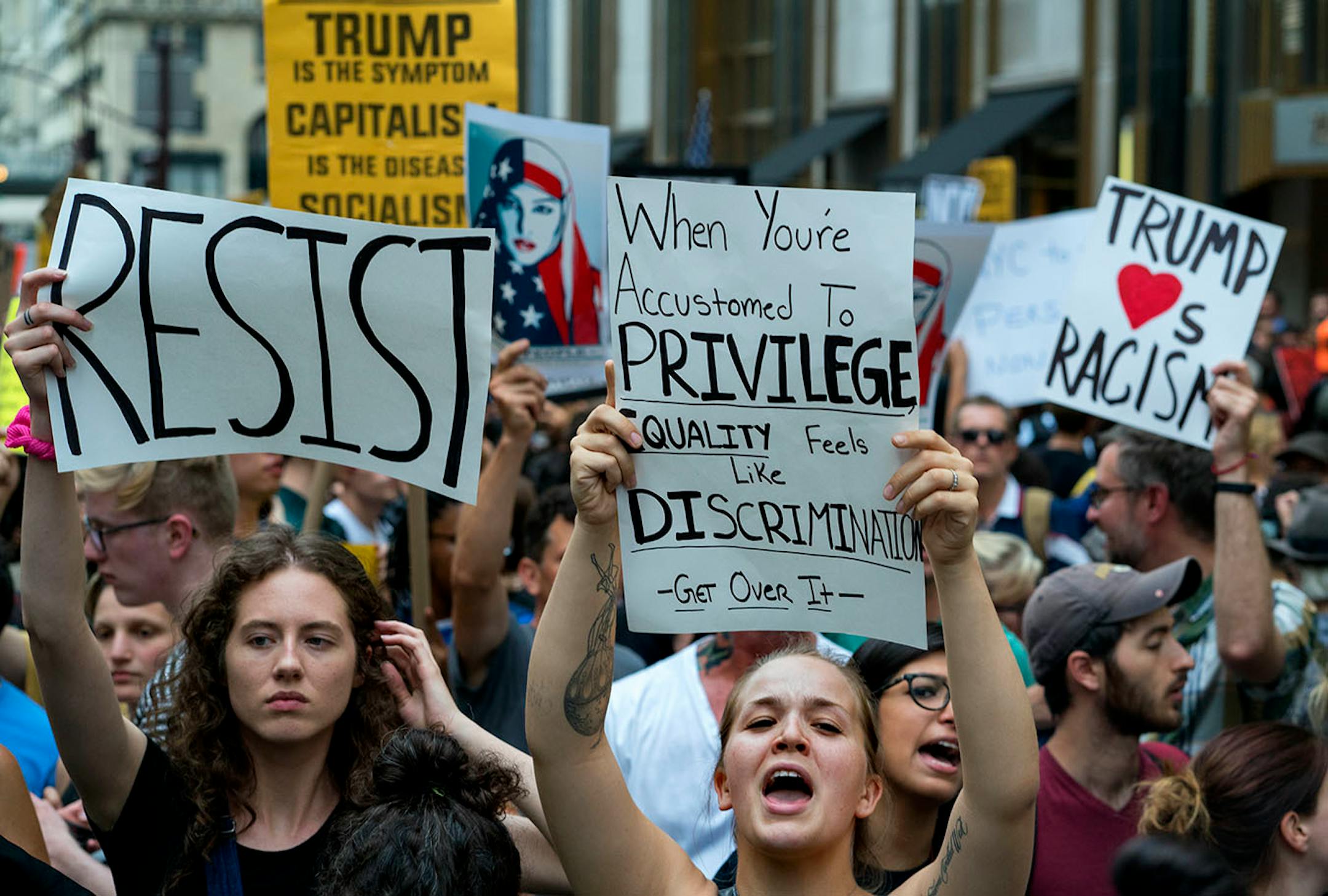 Protestors gather near Trump Tower in New York Monday, Aug. 14, 2017, as they protest against President Donald Trump.