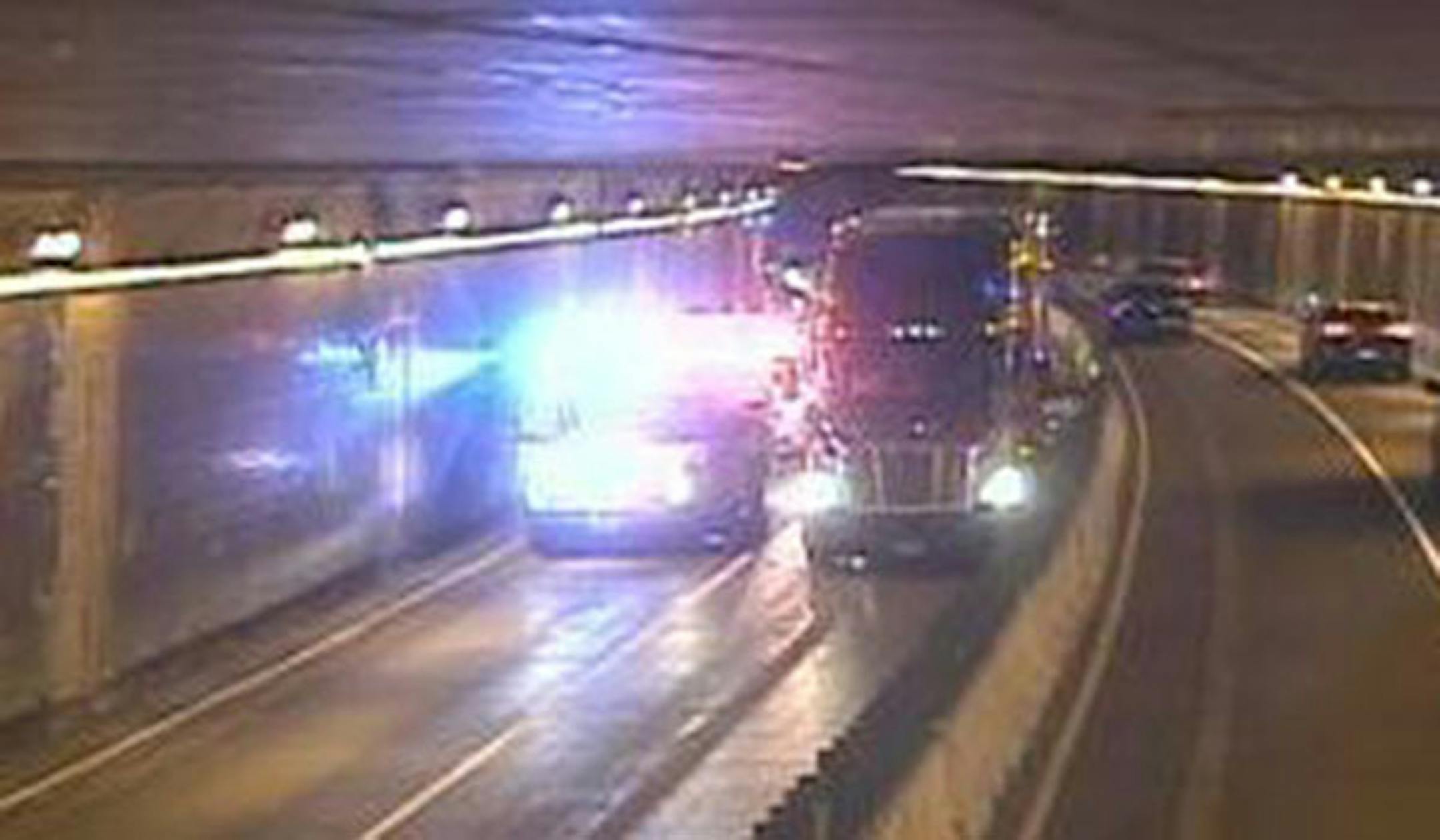 In a picture taken from MnDOT's traffic cameras, a westbound semitrailer truck blocked traffic in the Lowry Hill tunnel after being involved in a crash Thursday night.