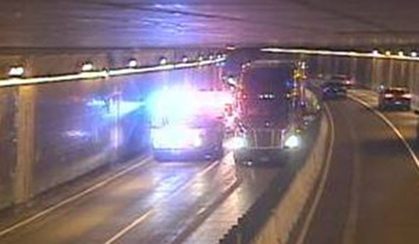 In a picture taken from MnDOT's traffic cameras, a westbound semitrailer truck blocked traffic in the Lowry Hill tunnel after being involved in a crash Thursday night.