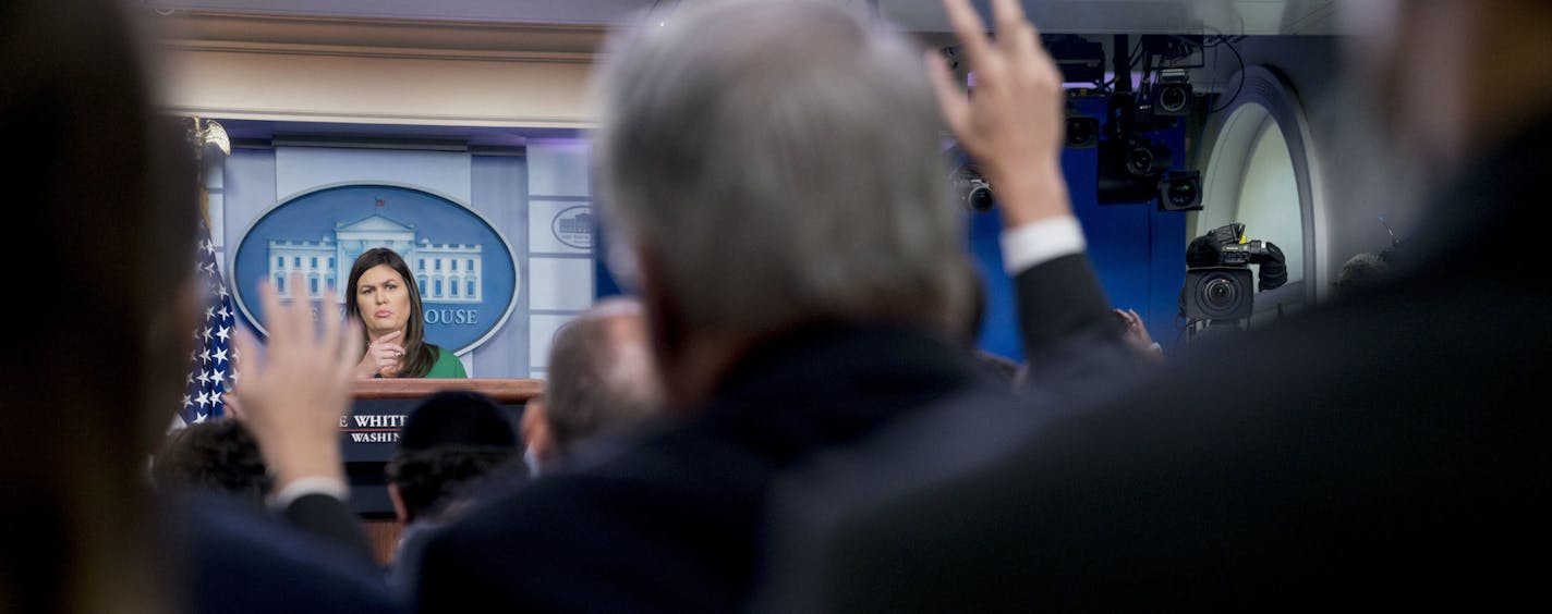 White House press secretary Sarah Huckabee Sanders calls on a member of the media during the daily press briefing at the White House, Wednesday, Aug. 15, 2018, in Washington. Sanders announced that President Donald Trump will remove the security clearance from former Obama administration CIA director John Brennan, a vocal critic of the president, and the administration will be reviewing the security clearances for a number of other former officials. (AP Photo/Andrew Harnik)