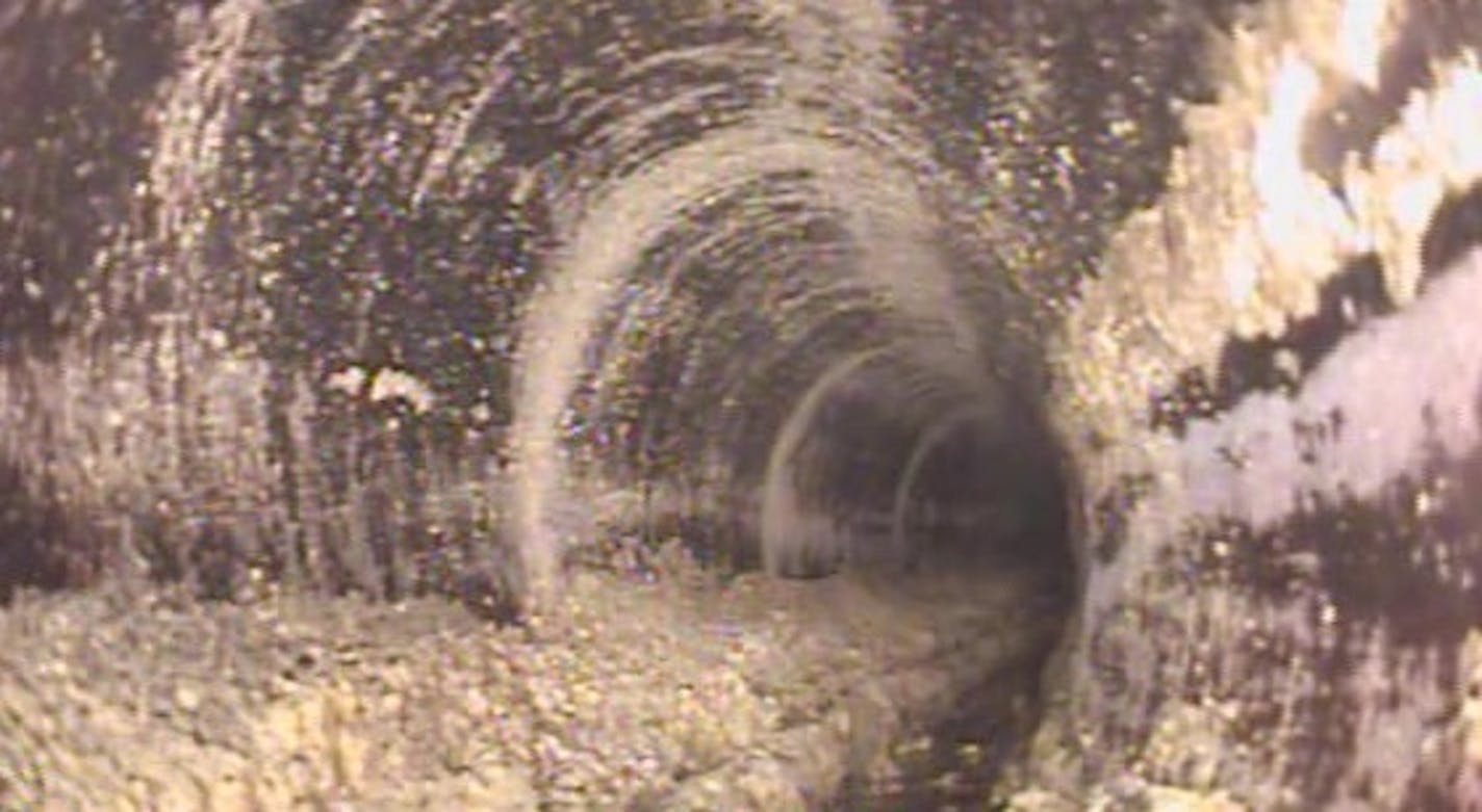 An image captured by a sewer-trolling robot illustrates the fats, oils and grease that collect on sewer pipes. Minneapolis, and a number of other cities, are taking steps to reduce so-called "FOG" in the sewers.