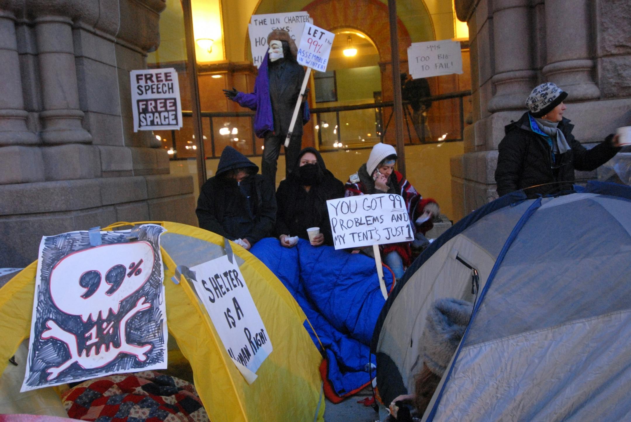 About a dozen Occupy Minneapolis protestors moved from Hennepin County Government Plaza to Minneapolis City Hall where they set up some tents and were holding vigil early Thursday morning, December 1, 2011. Overnight Hennepin County Sheriff's deputies removed about 30 tents from the Hennepin County Government Plaza .