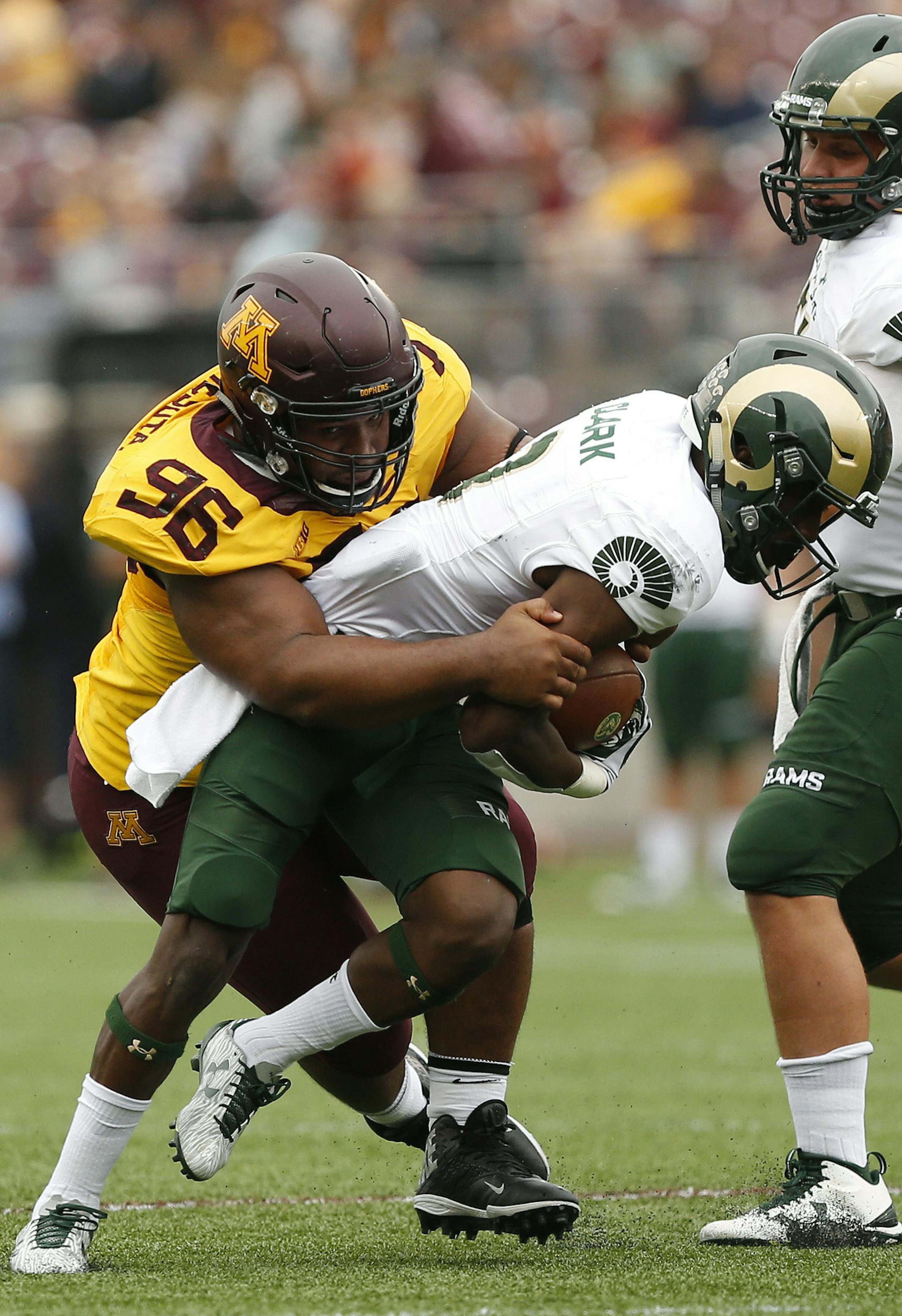 Minnesota defensive lineman Steven Richardson (96) tries to tackle Colorado State wide receiver Detrich Clark during an NCAA college football game Saturday, Sept. 24, 2016, in Minneapolis. Minnesota won 31-24. (AP Photo/Stacy Bengs) ORG XMIT: MNSB108