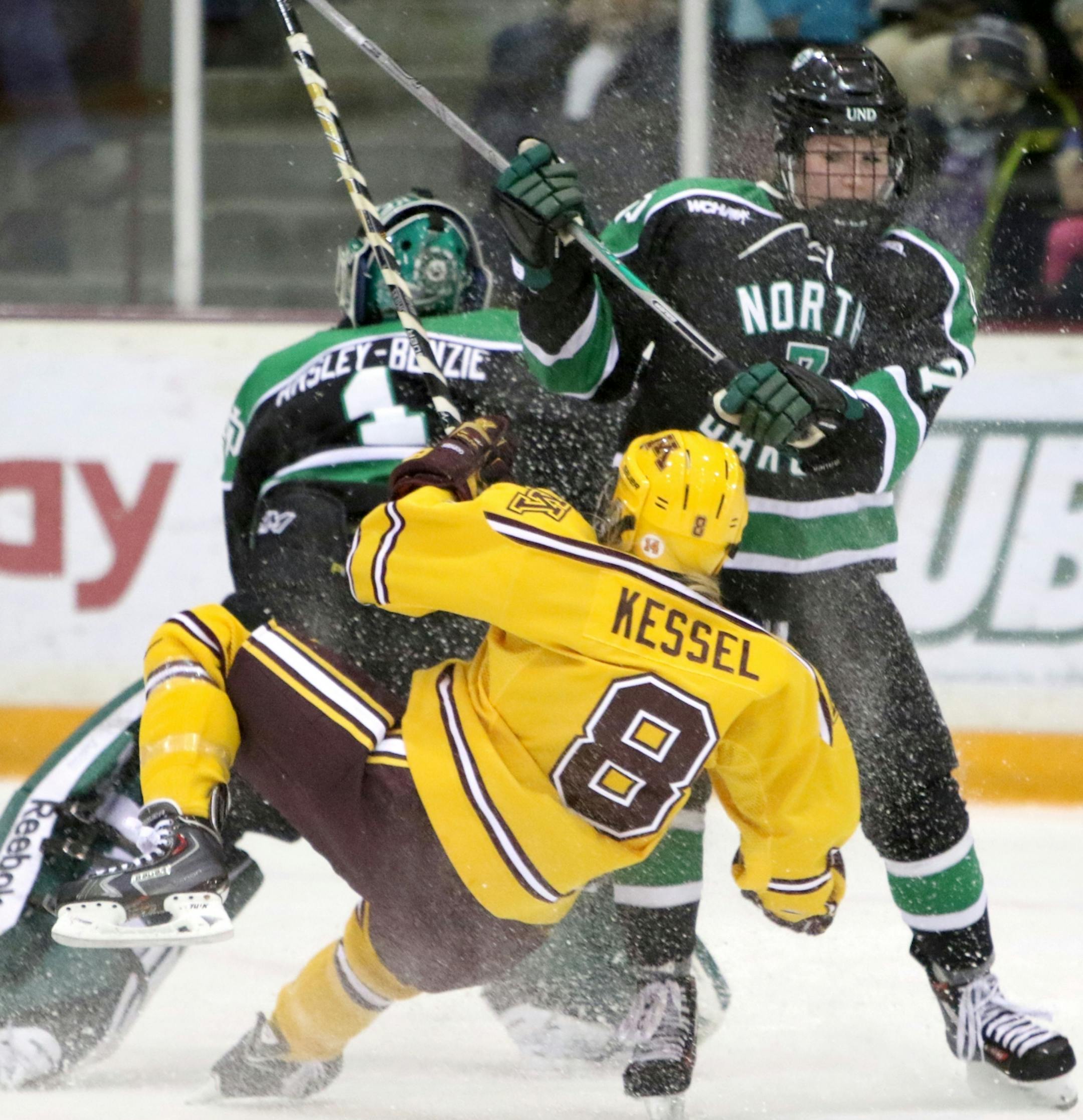 Amanda Kessel (8) had a hard collision with North Dakota goalie Shelby Amsley-Benzie during the first period Friday, Feb. 5, 2016, at Ridder Arena on the campus of the University of Minnesota in Minneapolis, MN.