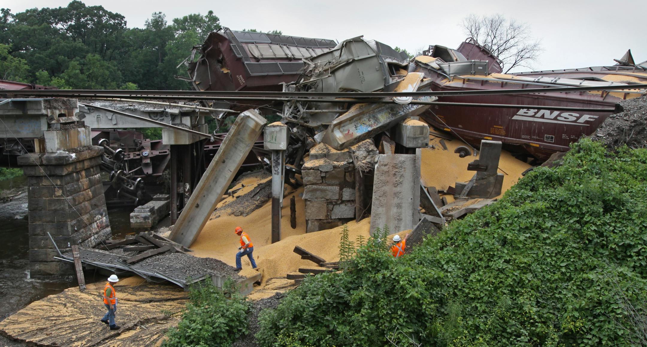 A Burlington Northern Santa Fe engine and cars destroyed half of the bridge and tracks over Rice Creek after derailing near Plaza Park in Fridley on Saturday 7/16/2011.
