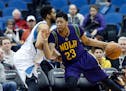 Pelicans forward Anthony Davis tried to drive around the Wolves' Karl-Anthony Towns in a Feb. 8 meeting at Target Center.