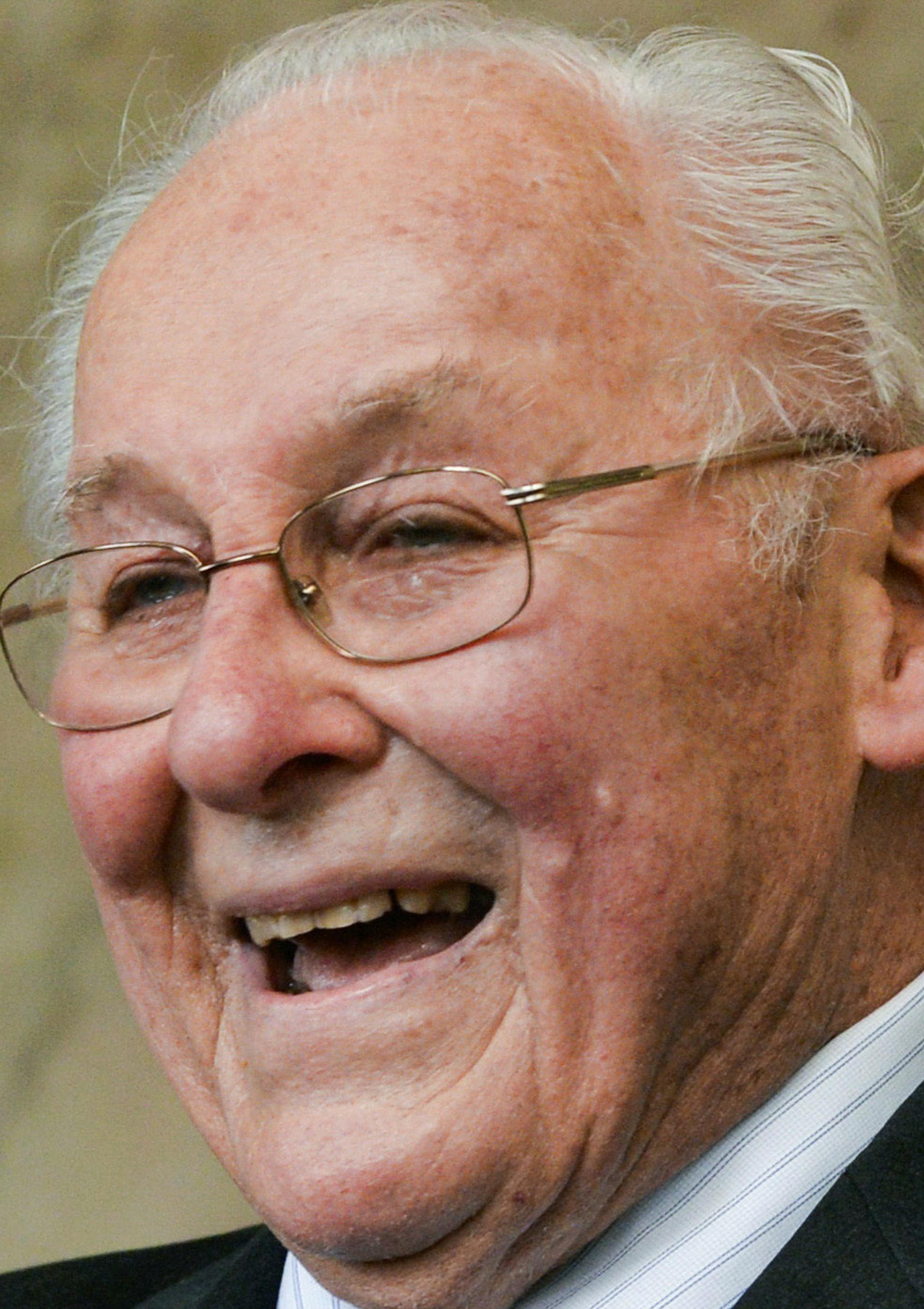 In this April 26, 2013 photo, former House Republican Leader Bob Michel smiles at his 90th birthday party in Peoria, Ill. Michel, an affable Illinois congressman who served as leader of the Republican House minority for 14 years and was skilled at seeking compromise critical in getting many initiatives of two Republican presidents through Congress, died Friday, Feb. 17, 2017. He was 93. (Ron Johnson /Journal Star via AP)