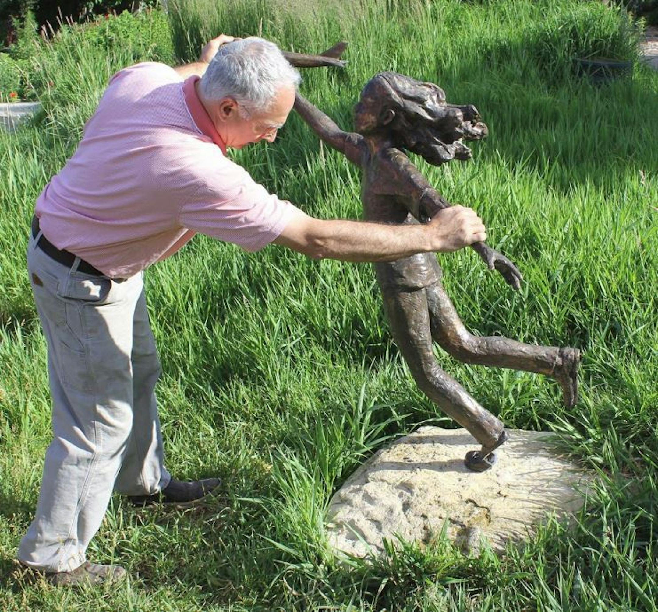 Creator Nick Legeros installs "Dreams Take Flight" in Edina's Centennial Lakes Park.