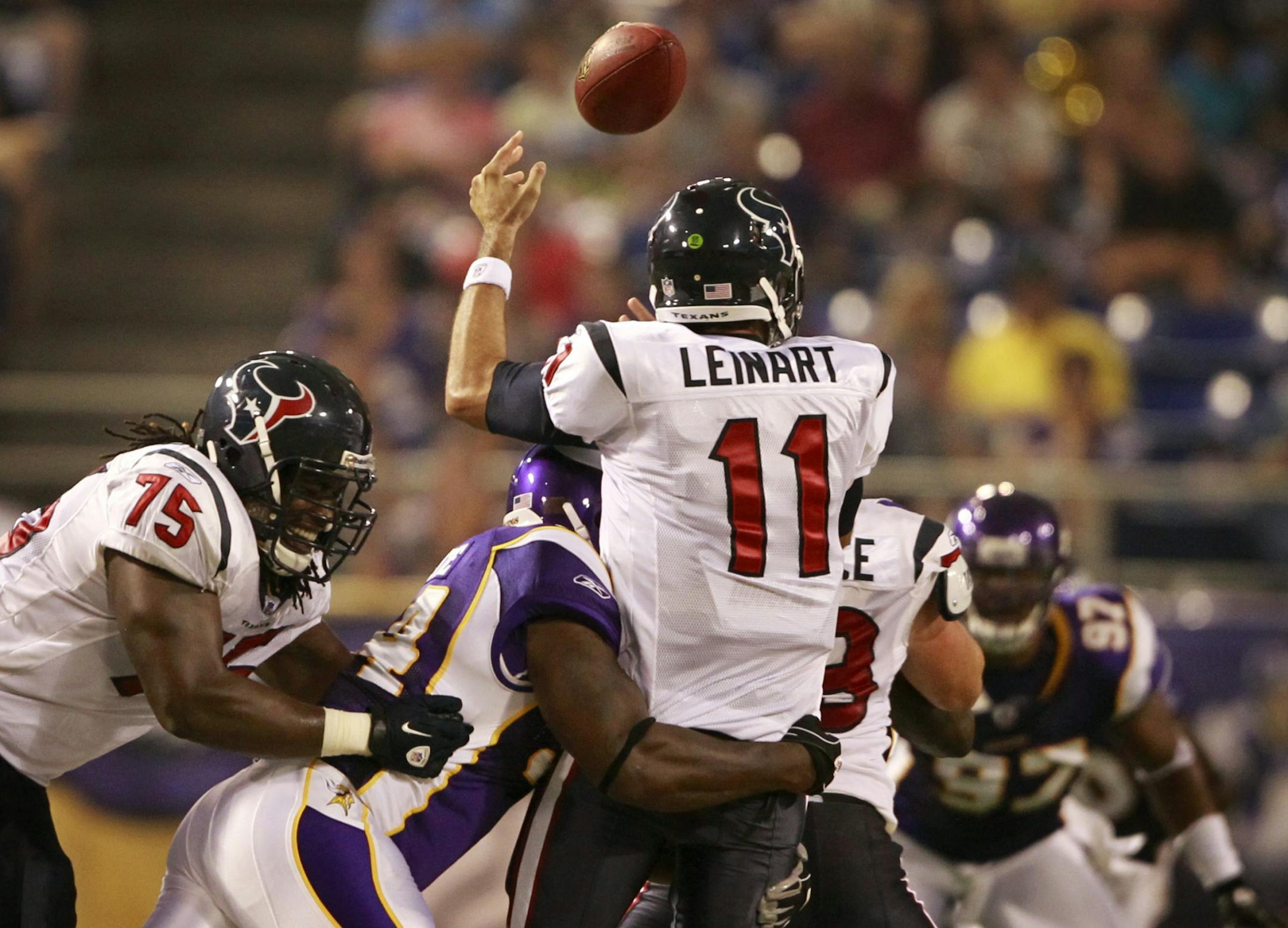 Vikings defensive end Stylez White hits Houston's quarterback Matt Leinart during Thursday night pre-season action at Mall of America Field in Minneapolis, MN. Houston recovered the fumble by lost seven yards on the play.